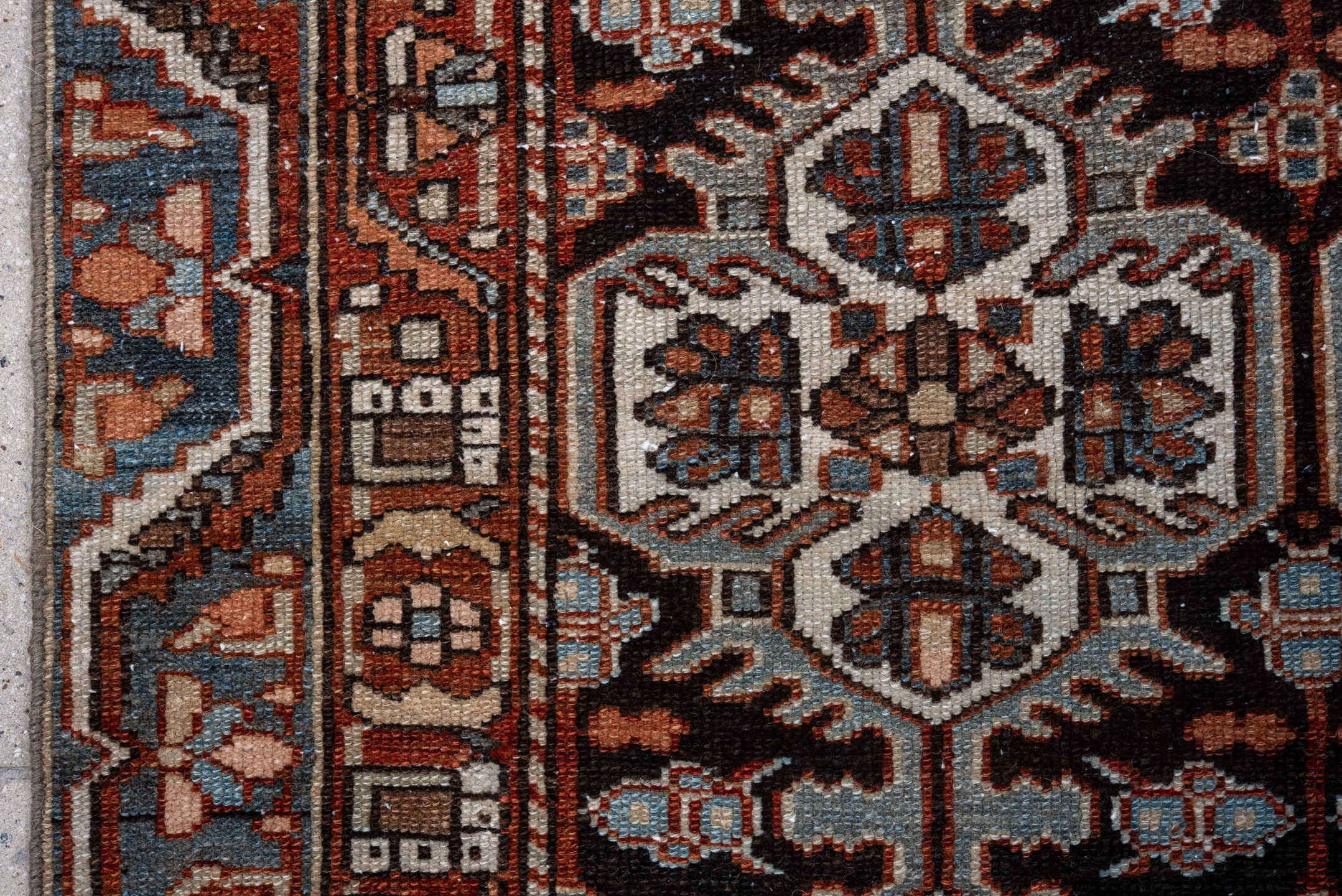 4' x 5' one-of-a-kind handmade vintage Baktiary small size rug. Color palette: black, brown, charcoal, gray, light gray