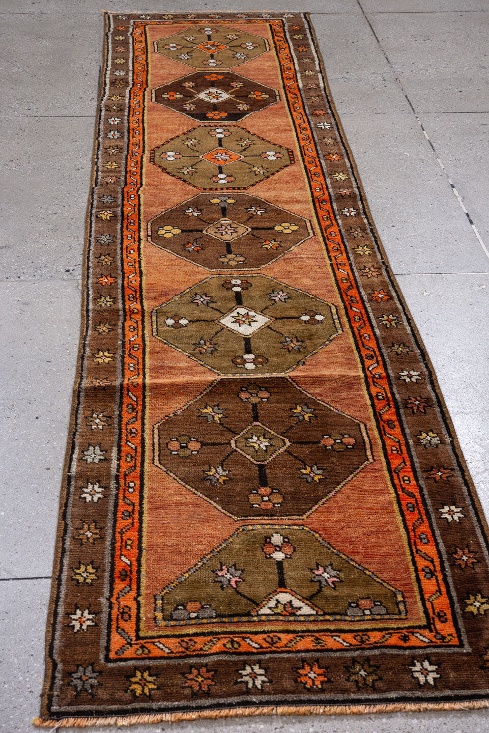 2' x 10' one-of-a-kind handmade antique Kars runner rug. Color palette: salmon, brown, olive, rust, ivory, coral, taupe