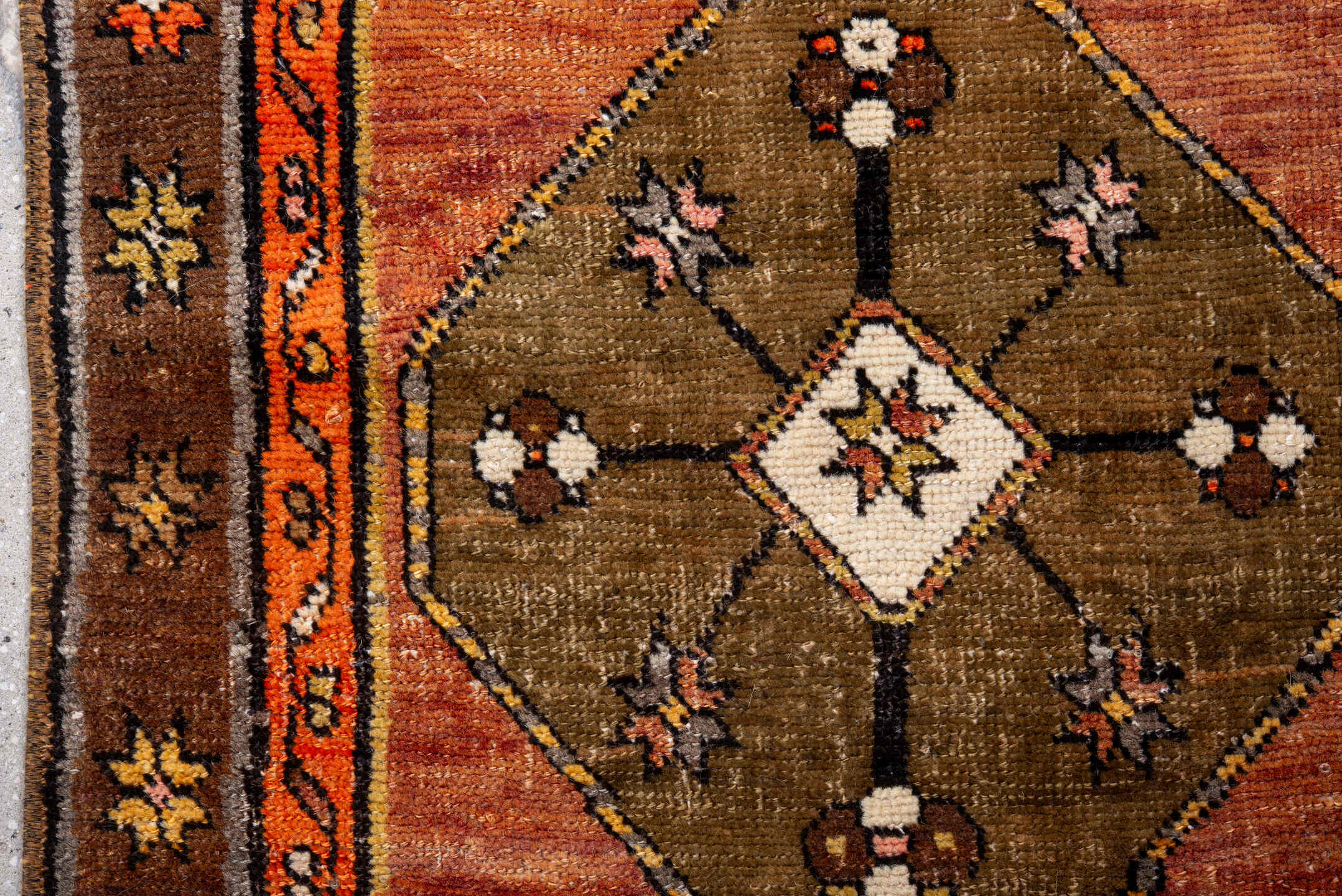 2' x 10' one-of-a-kind handmade antique Kars runner rug. Color palette: salmon, brown, olive, rust, ivory, coral, taupe