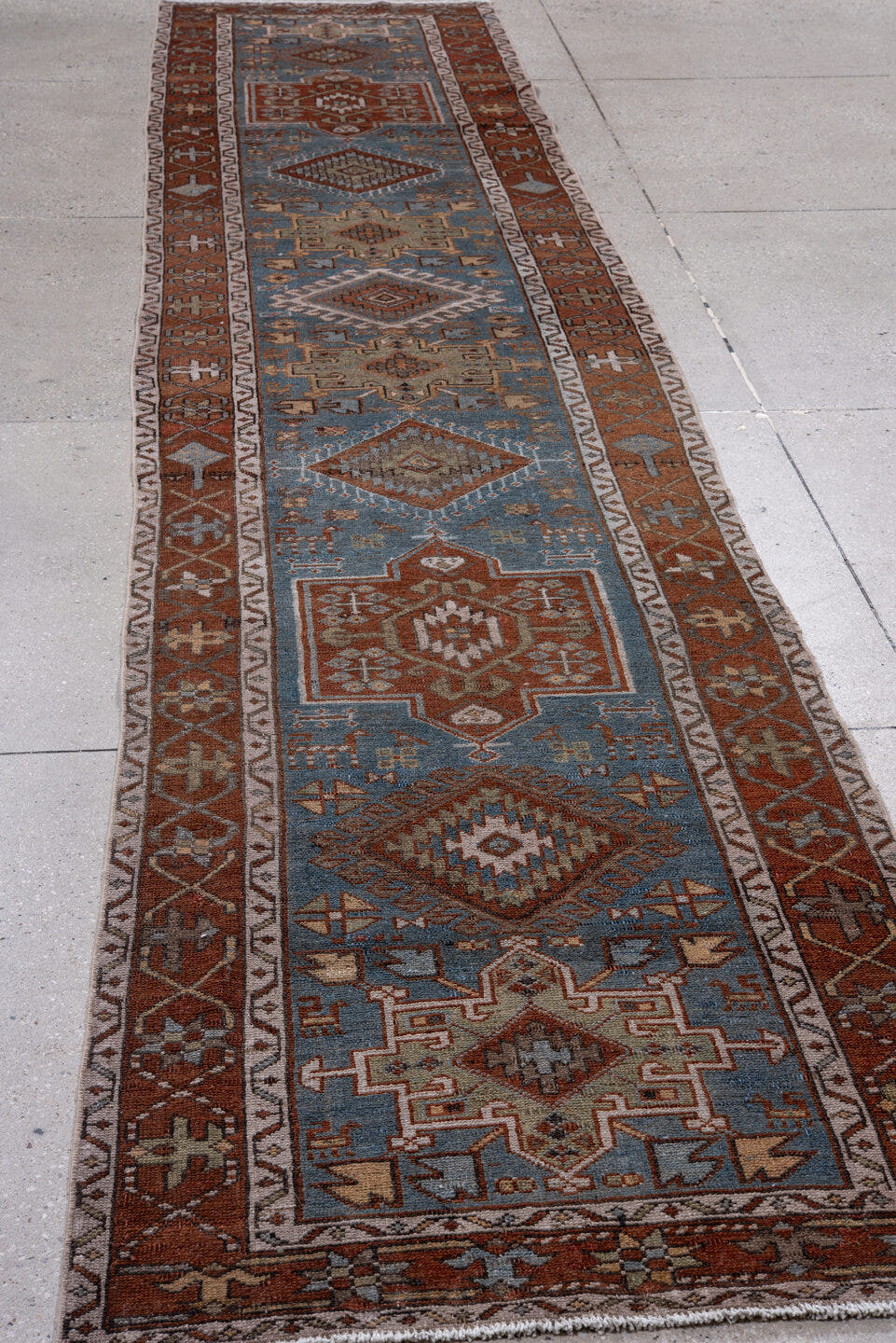 2' x 14' one-of-a-kind handmade vintage Heriz runner rug. Color palette: sky blue, rust, ivory, camel, taupe, brown