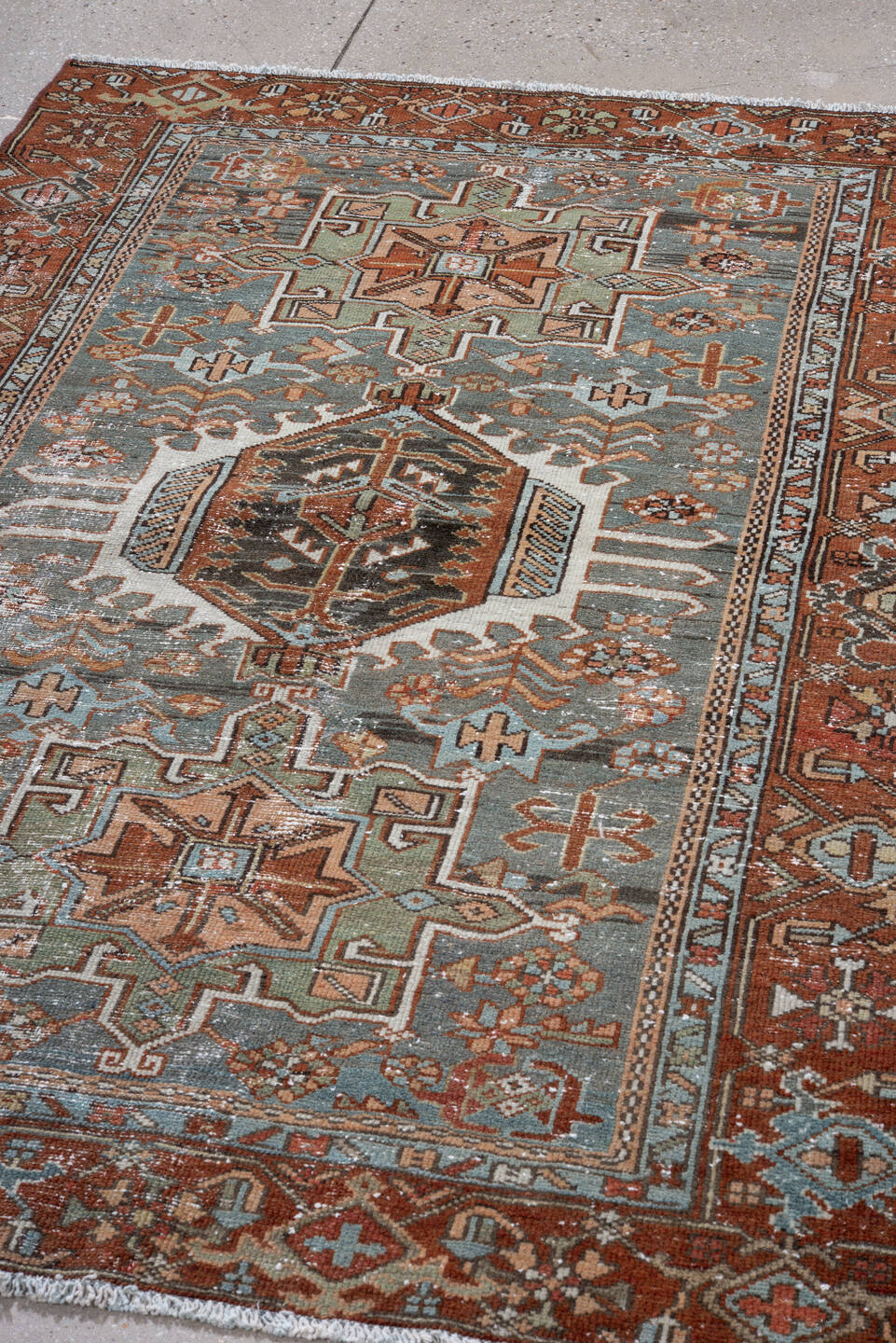 4' x 6' one-of-a-kind handmade antique Karaje small size rug. Color palette: rust, sky blue, ivory, sage, camel, charcoal