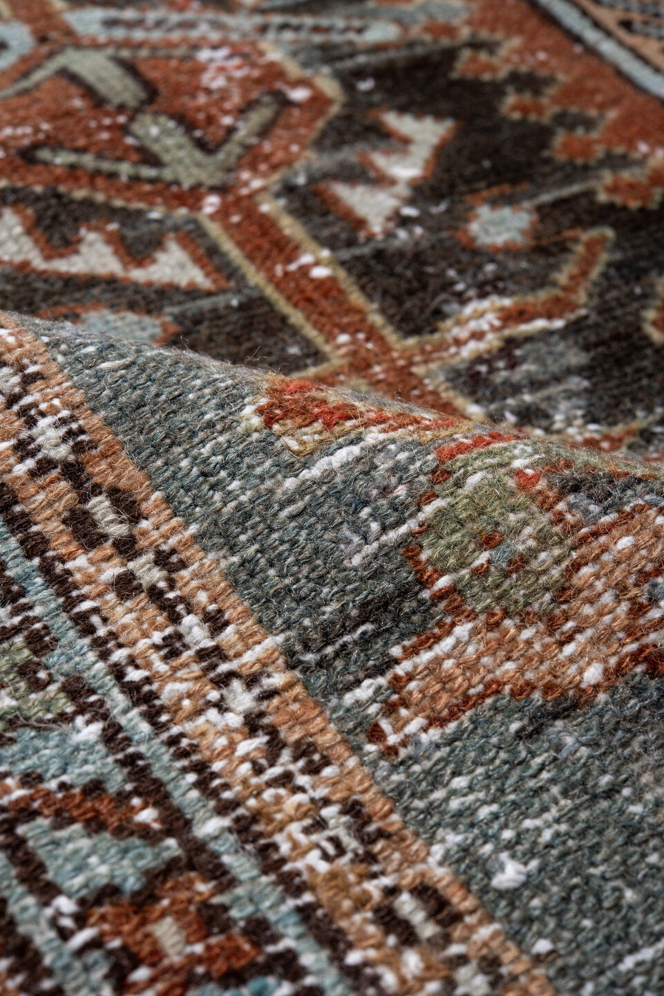 4' x 6' one-of-a-kind handmade antique Karaje small size rug. Color palette: rust, sky blue, ivory, sage, camel, charcoal