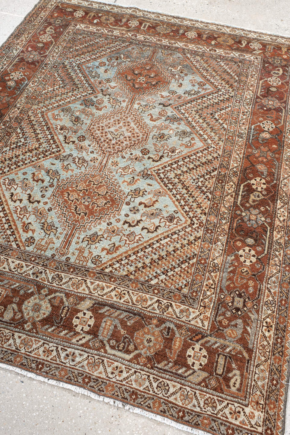 4' x 5' one-of-a-kind handmade antique Afshar small size rug. Color palette: rust, ivory, light blue, brown, camel, charcoal