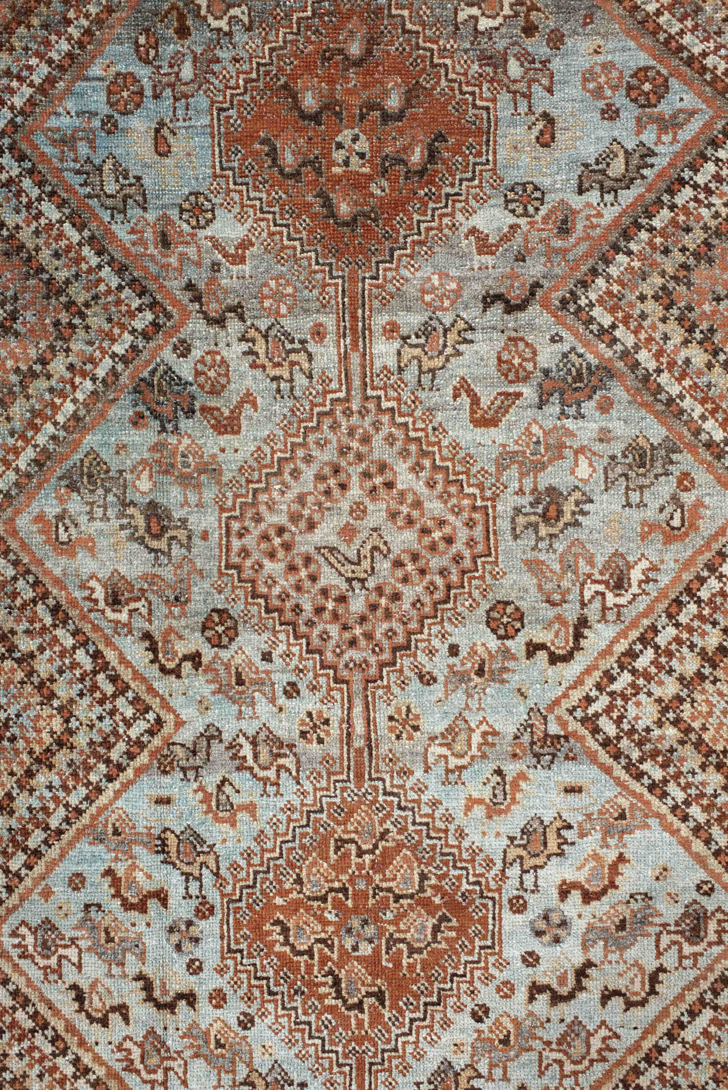4' x 5' one-of-a-kind handmade antique Afshar small size rug. Color palette: rust, ivory, light blue, brown, camel, charcoal