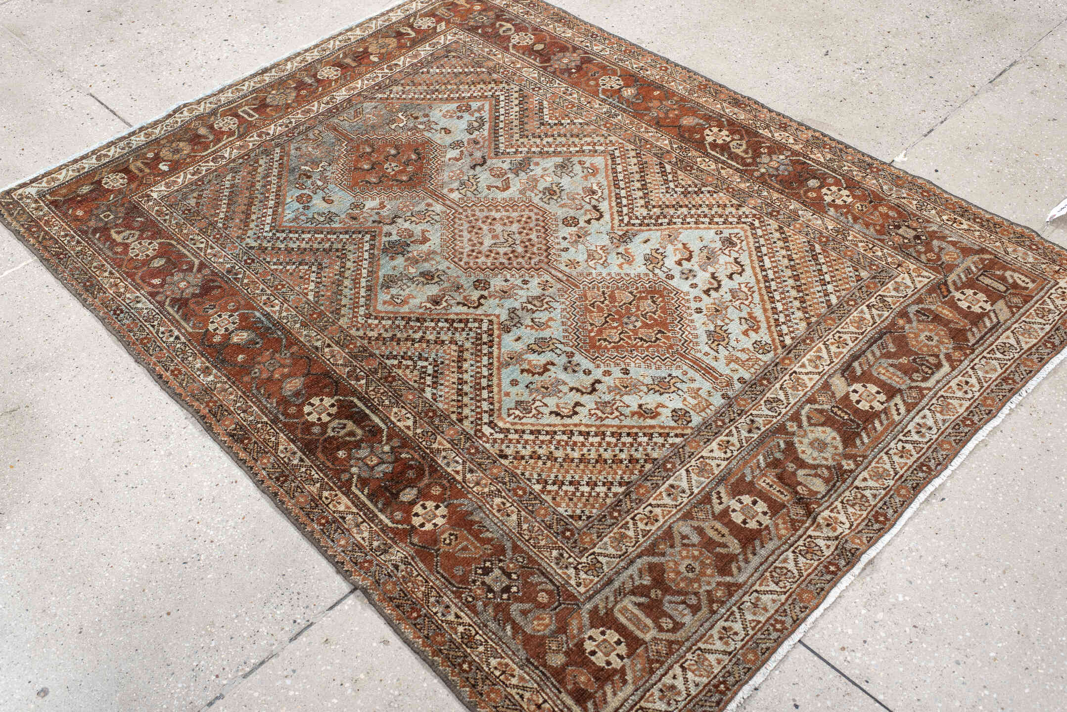4' x 5' one-of-a-kind handmade antique Afshar small size rug. Color palette: rust, ivory, light blue, brown, camel, charcoal