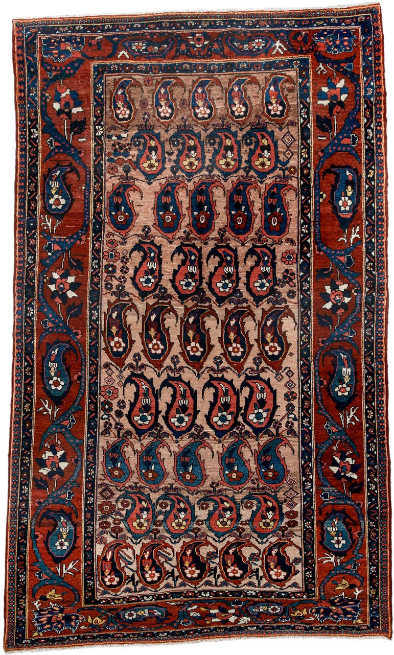 4' x 7' one-of-a-kind handmade antique Baktiary rug. Color palette: rust, indigo, ivory, brick, sky_blue, navy, cream, gold