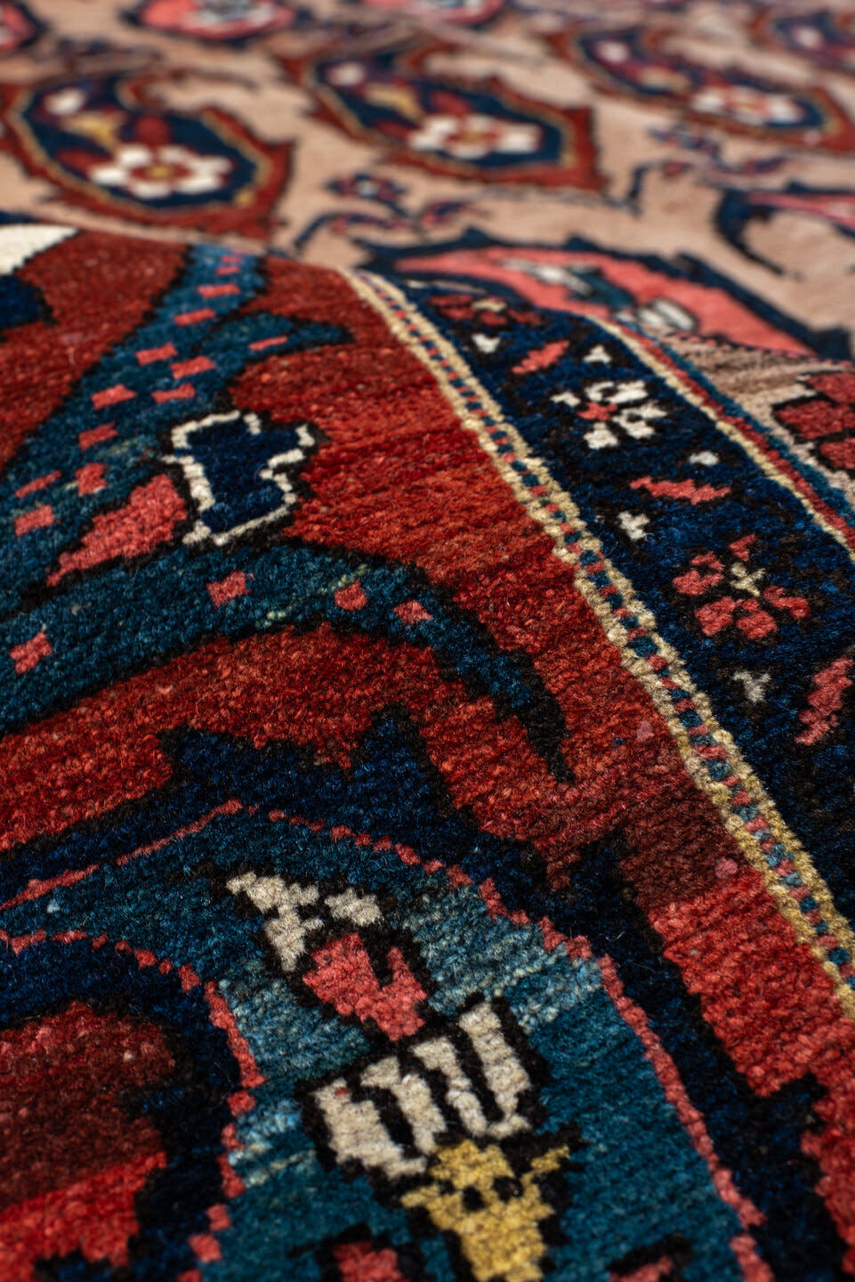 4' x 7' one-of-a-kind handmade antique Baktiary rug. Color palette: rust, indigo, ivory, brick, sky_blue, navy, cream, gold