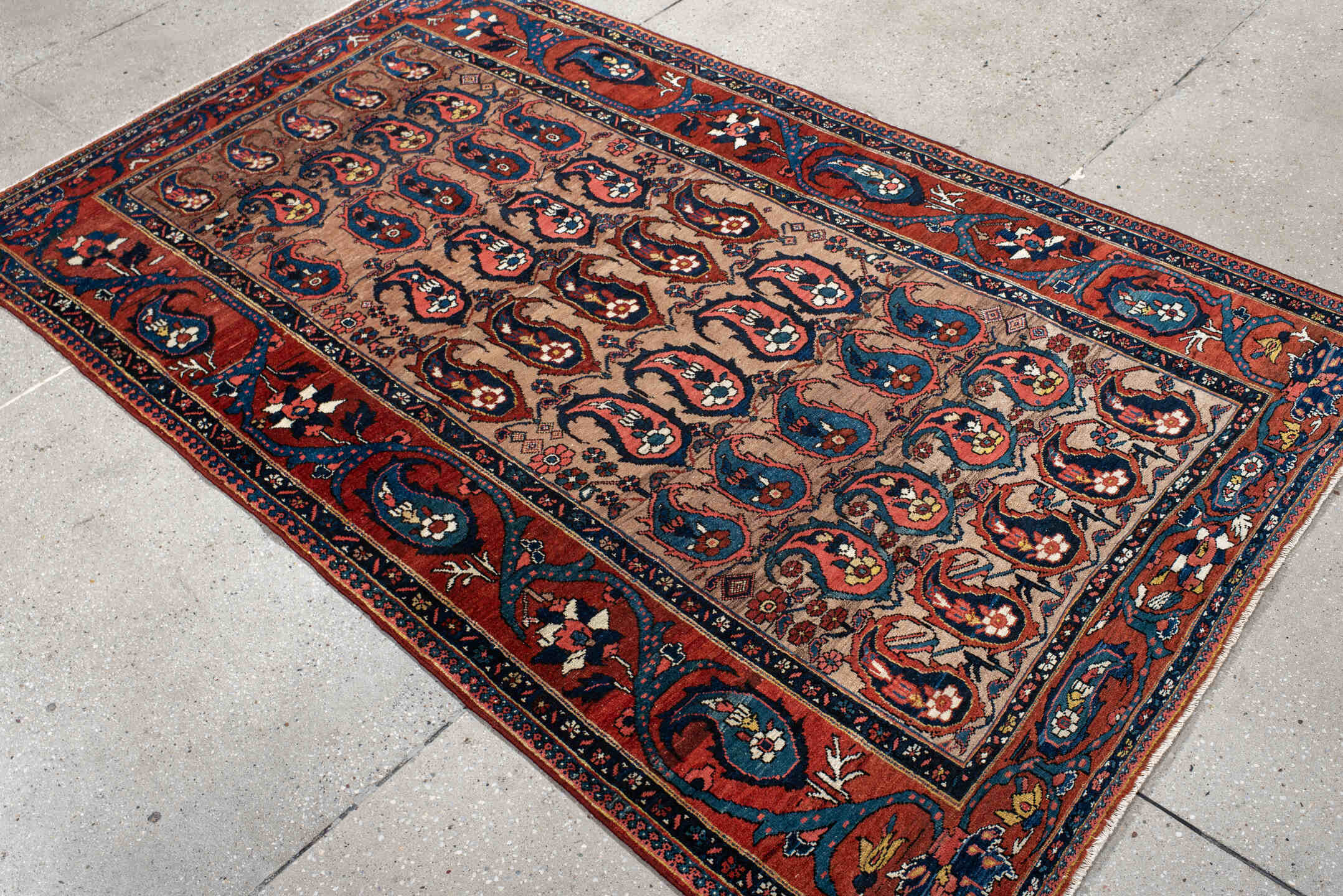 4' x 7' one-of-a-kind handmade antique Baktiary rug. Color palette: rust, indigo, ivory, brick, sky_blue, navy, cream, gold