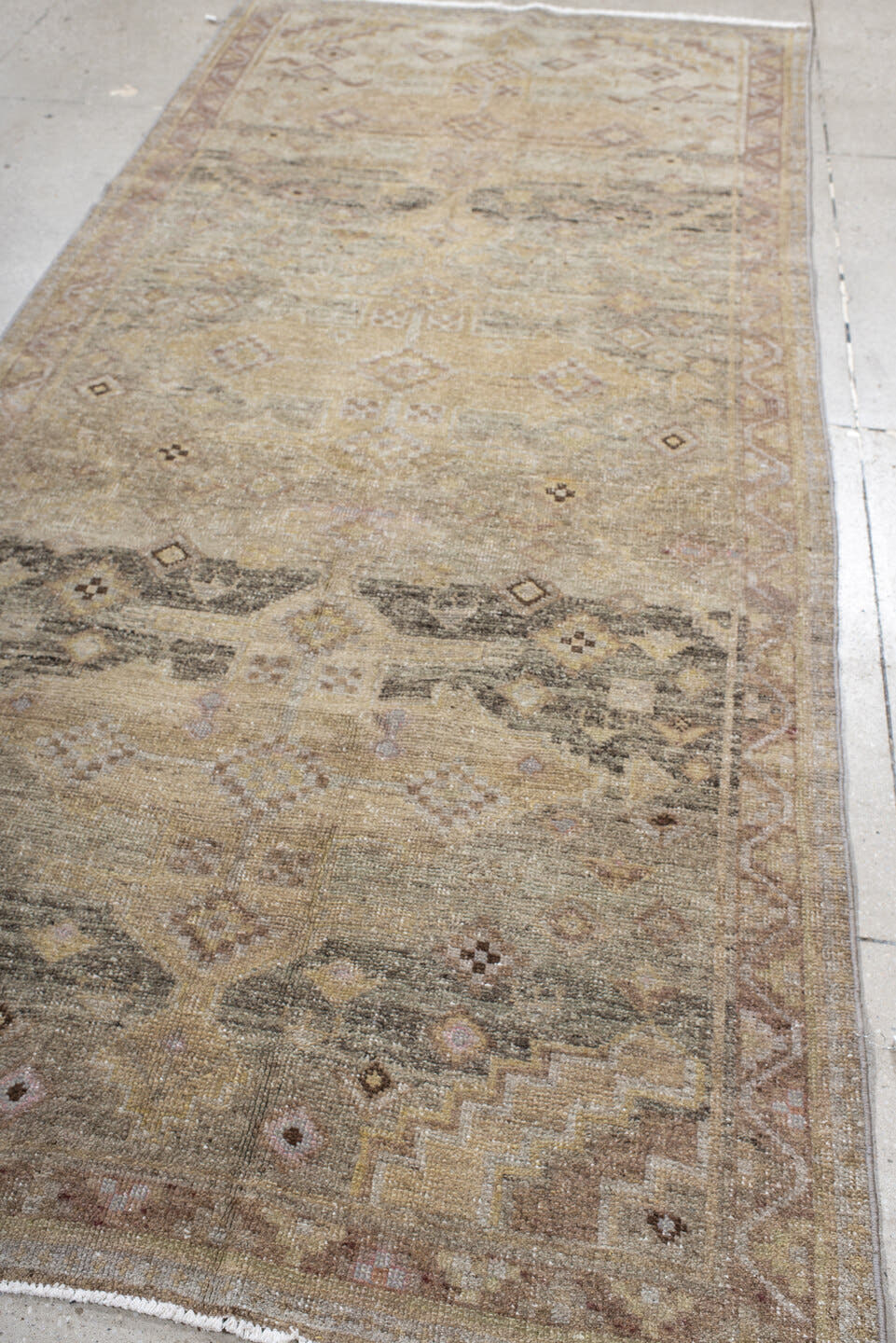 4' x 10' one-of-a-kind handmade antique Sarab runner rug. Color palette: ivory, camel, taupe, rose, charcoal, sage, tan