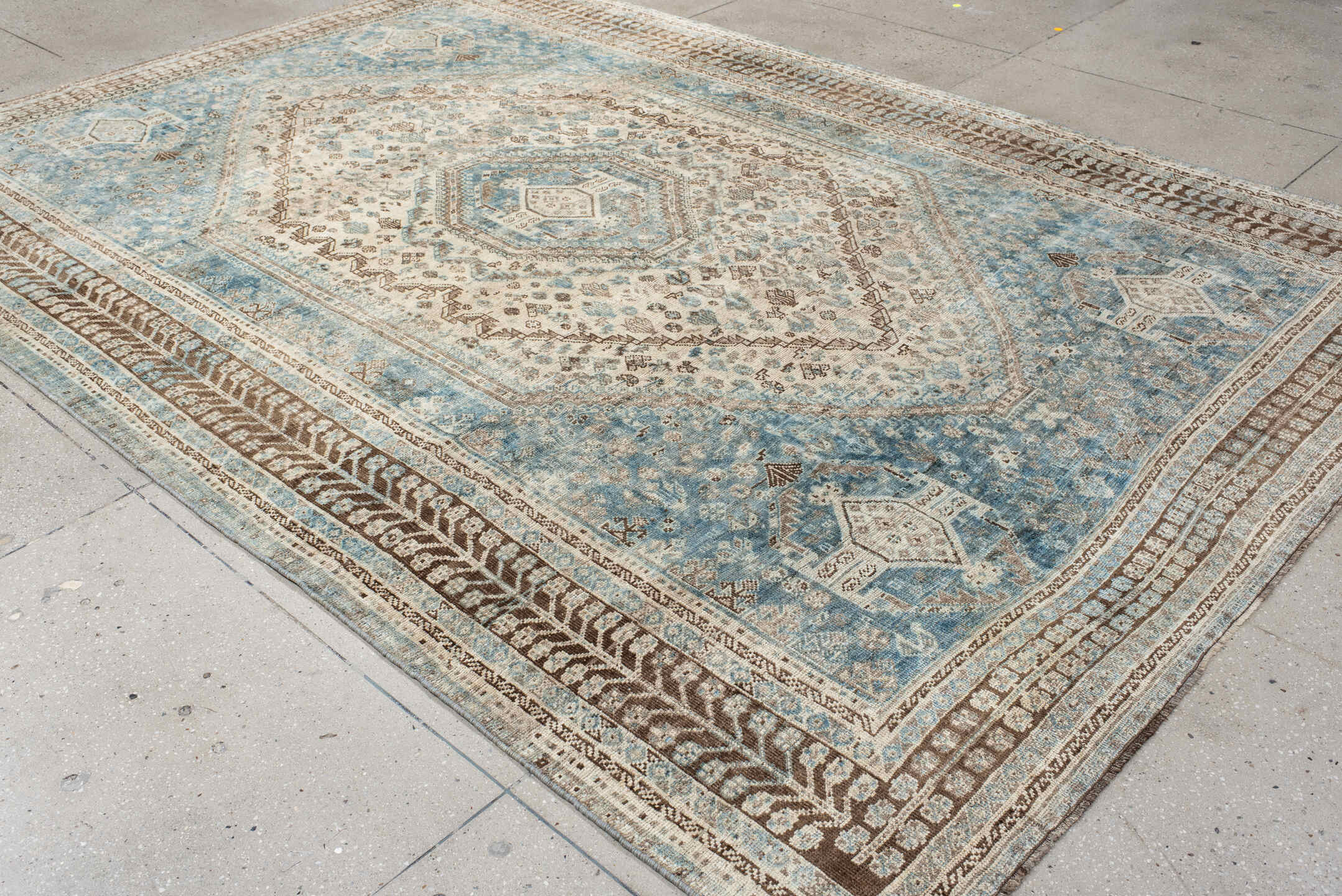 7' x 11' one-of-a-kind handmade antique Shiraz large size rug. Color palette: sky blue, ivory, brown, taupe, camel, slate