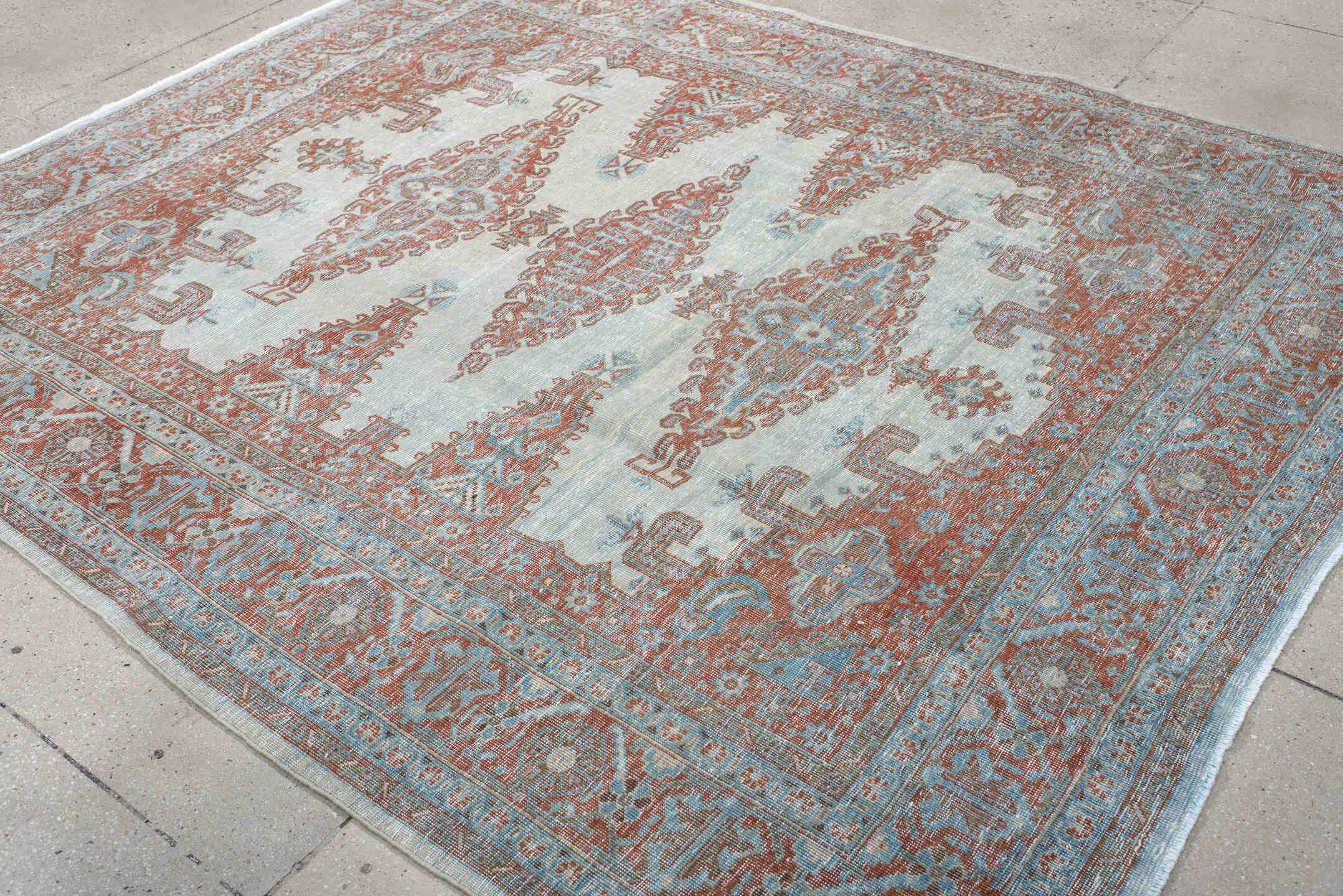 7' x 8' one-of-a-kind handmade antique Veece rug. Color palette: pale blue, rust, ivory, terracotta, sky blue, light blue