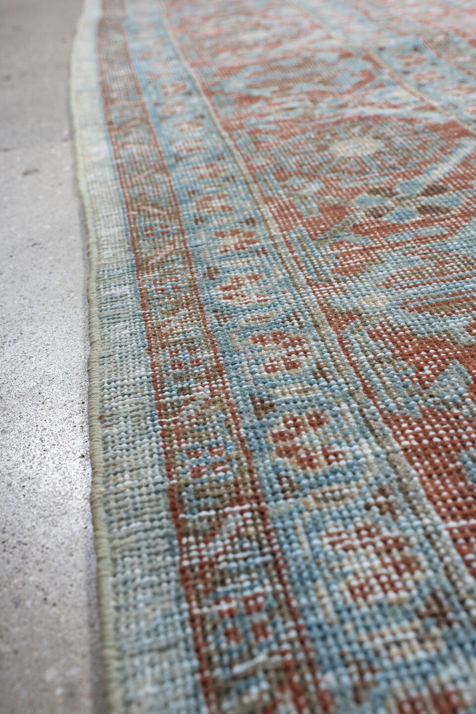 7' x 8' one-of-a-kind handmade antique Veece rug. Color palette: pale blue, rust, ivory, terracotta, sky blue, light blue