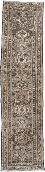 3' x 9' one-of-a-kind handmade antique Karaje runner rug. Color palette: taupe, brown, ivory, camel, slate, charcoal