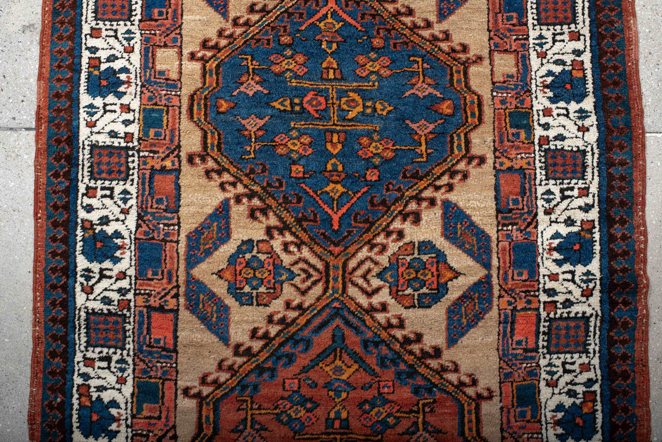 3' x 8' one-of-a-kind handmade antique Sarab runner rug. Color palette: ivory, indigo, rust, navy, terra cotta, camel