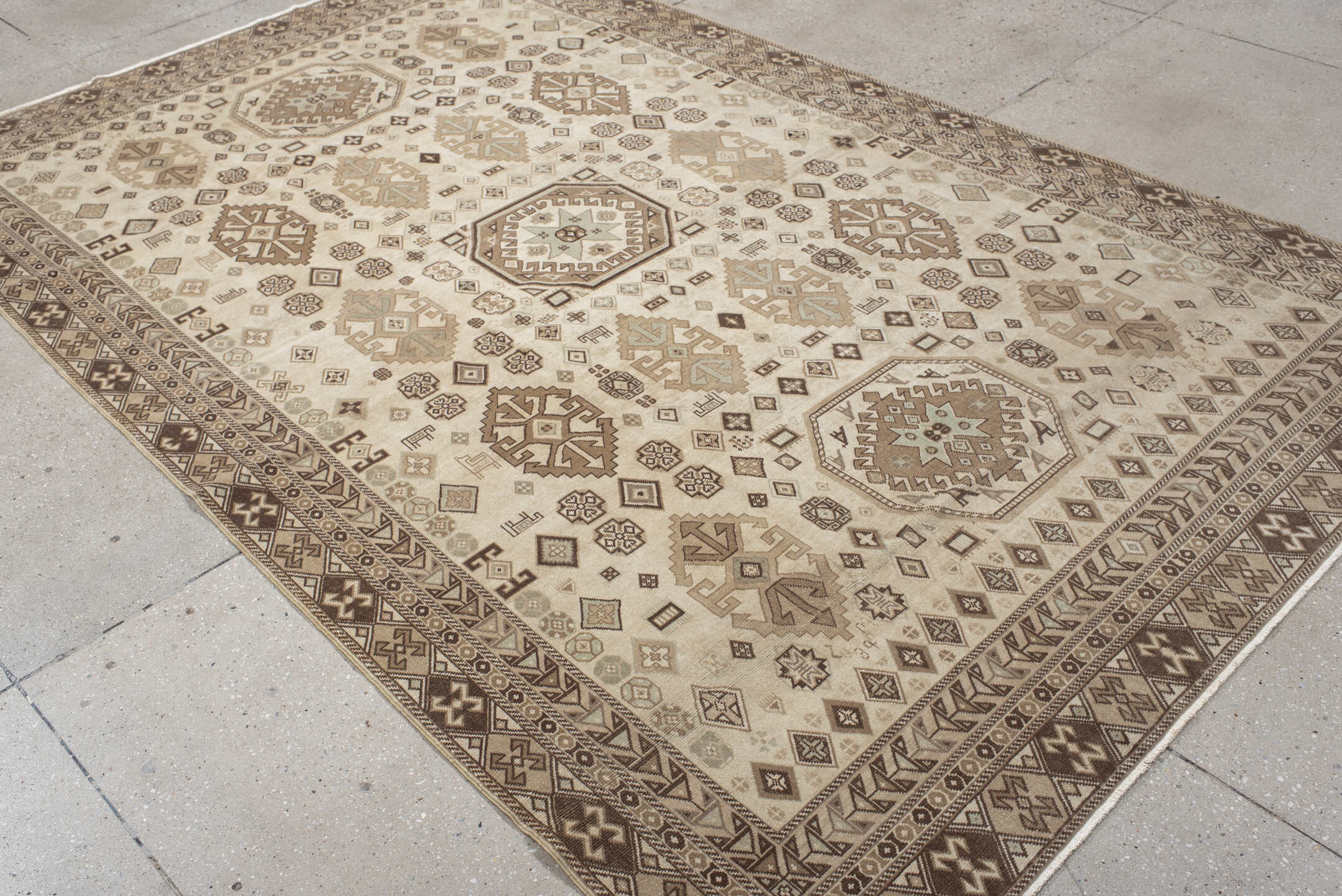 5' x 9' one-of-a-kind handmade vintage Ardebil medium size rug. Color palette: ivory, taupe, brown, camel, charcoal, greige