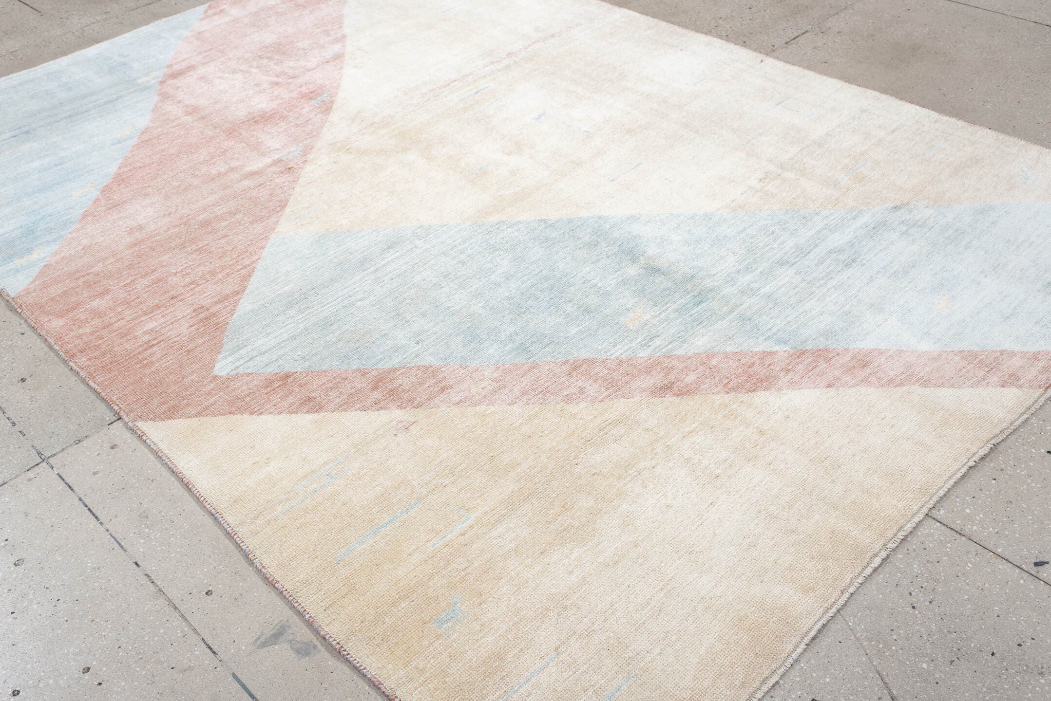6' x 9' one-of-a-kind handmade vintage Gabbe medium size rug. Color palette: ivory, pale blue, blush, cream, light blue
