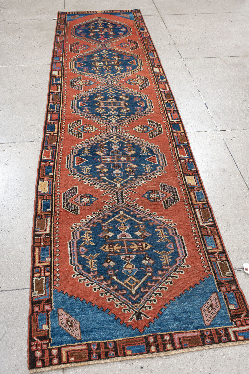 2' x 11' one-of-a-kind handmade vintage NW Persian runner rug. Color palette: terra cotta, navy, ivory, rust, sky blue
