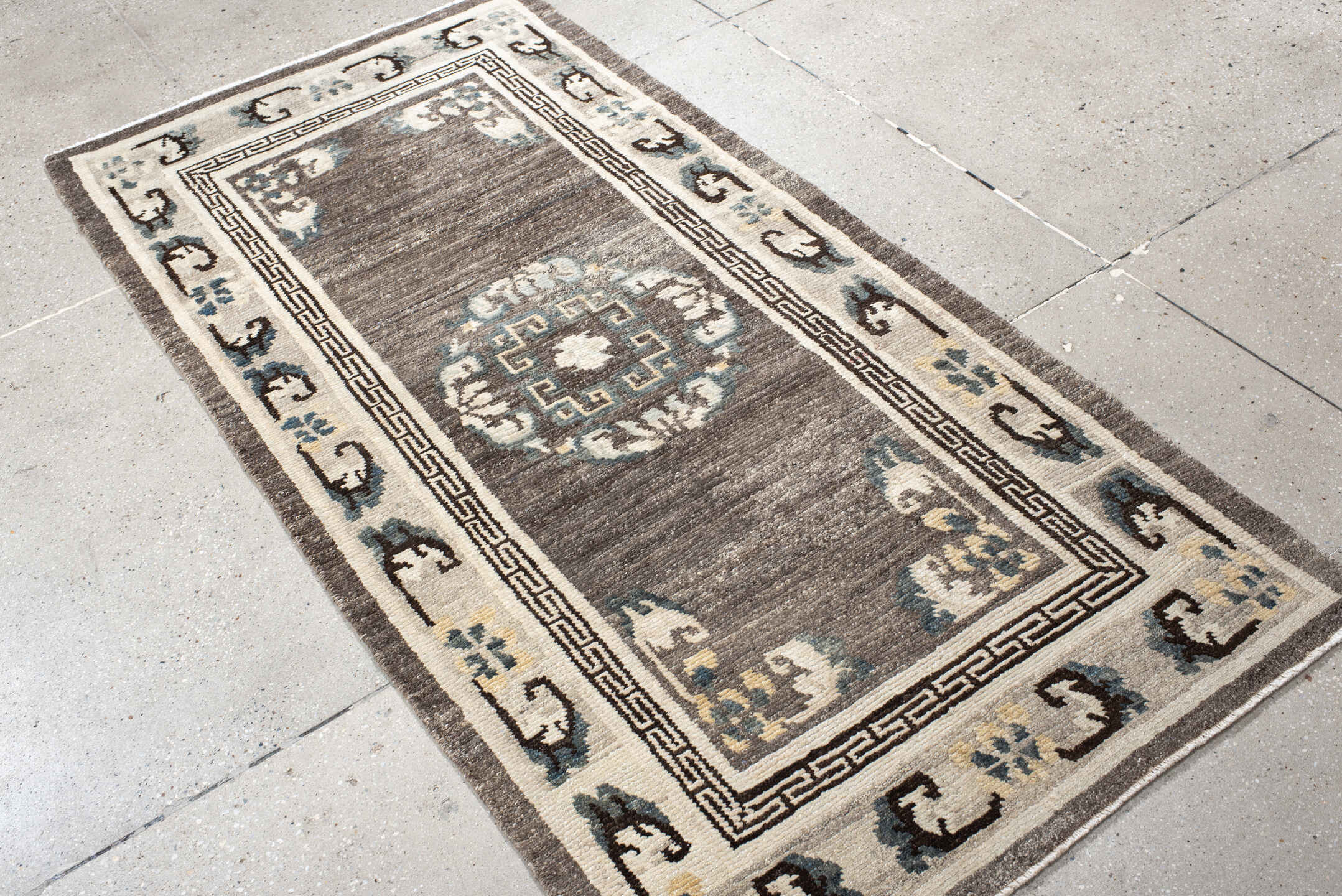 3' x 6' one-of-a-kind handmade antique Tibetan runner rug. Color palette: taupe, ivory, charcoal, slate, cream, gold, beige