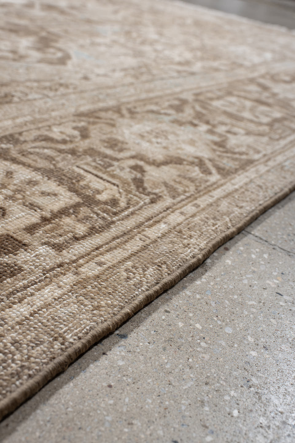 7' x 10' one-of-a-kind handmade antique Heriz large size rug. Color palette: ivory, taupe, beige, brown, camel, pale blue