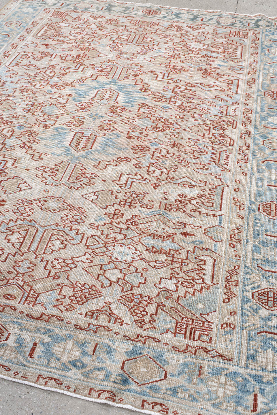 6' x 8' one-of-a-kind handmade antique Heriz medium size rug. Color palette: ivory, sky_blue, terracotta, pale_blue, rust