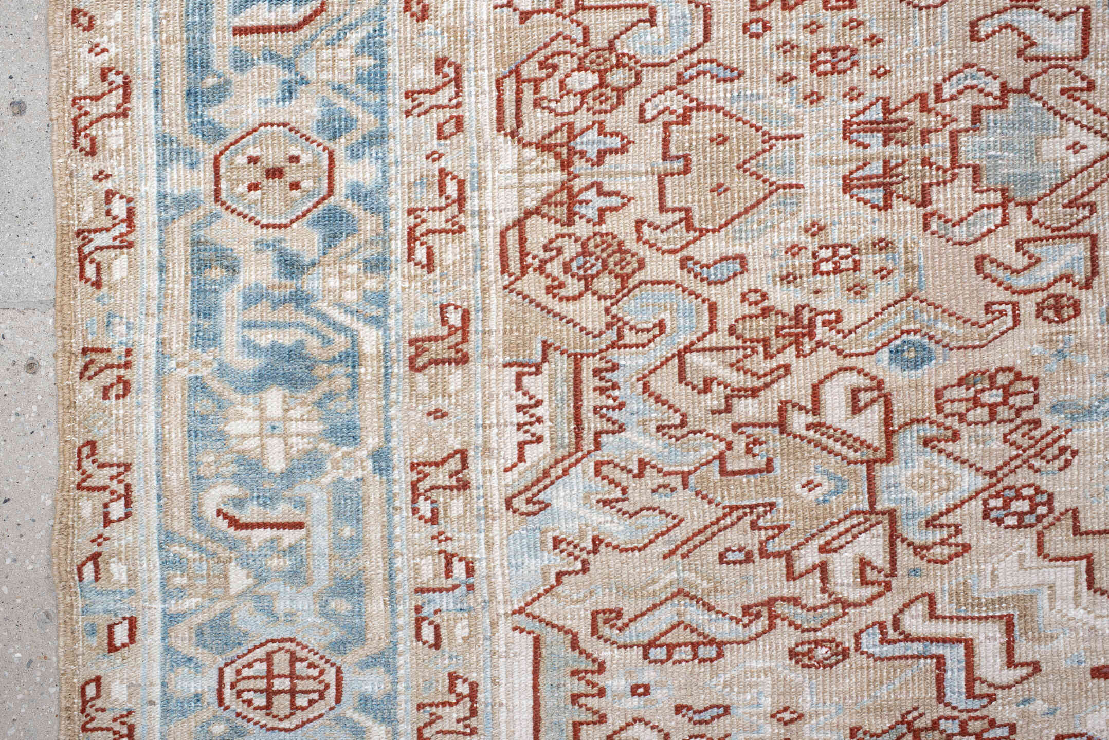 6' x 8' one-of-a-kind handmade antique Heriz medium size rug. Color palette: ivory, sky_blue, terracotta, pale_blue, rust