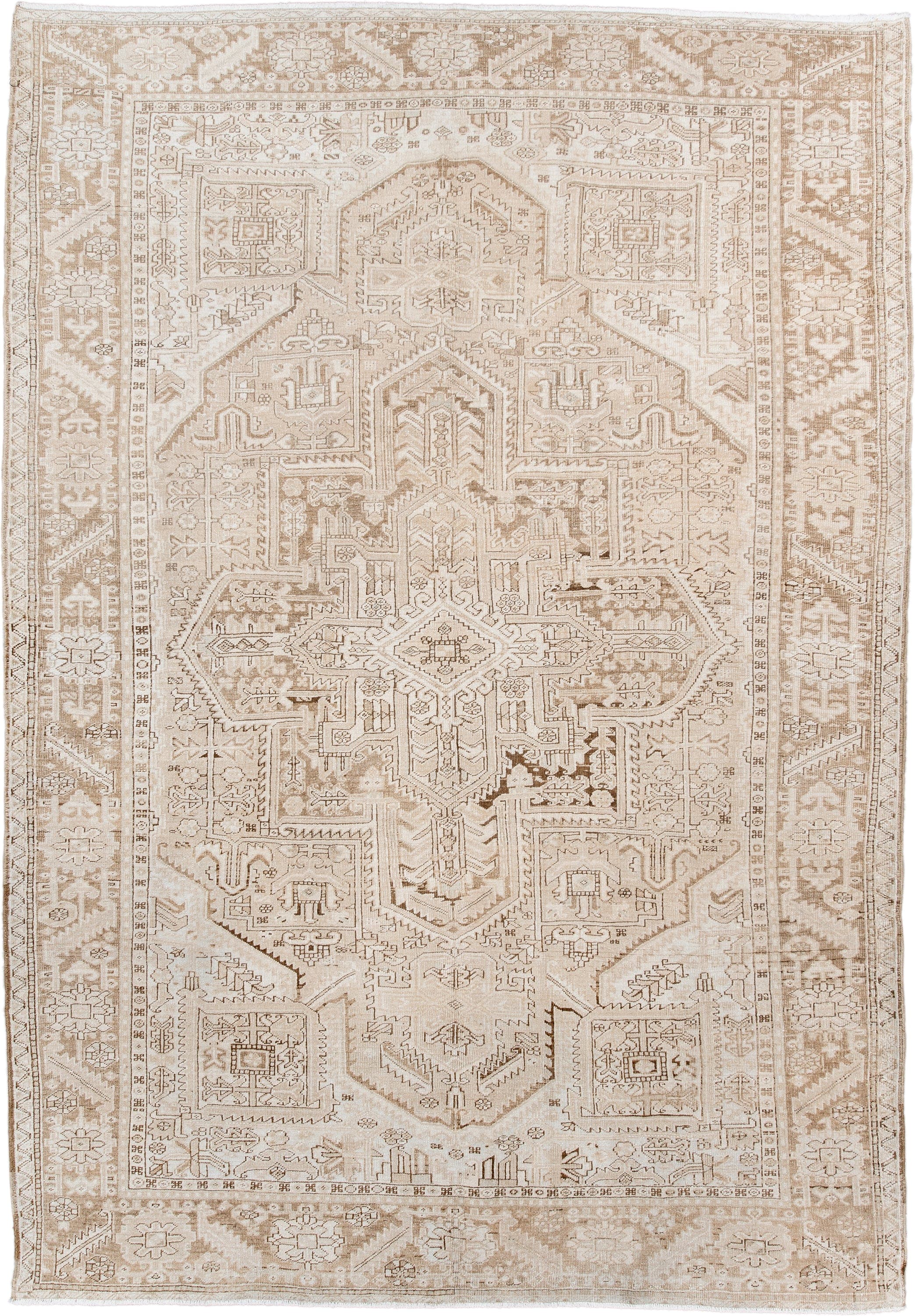 6' x 9' one-of-a-kind handmade antique Heriz medium size rug. Color palette: ivory, taupe, beige, sand, camel, gray