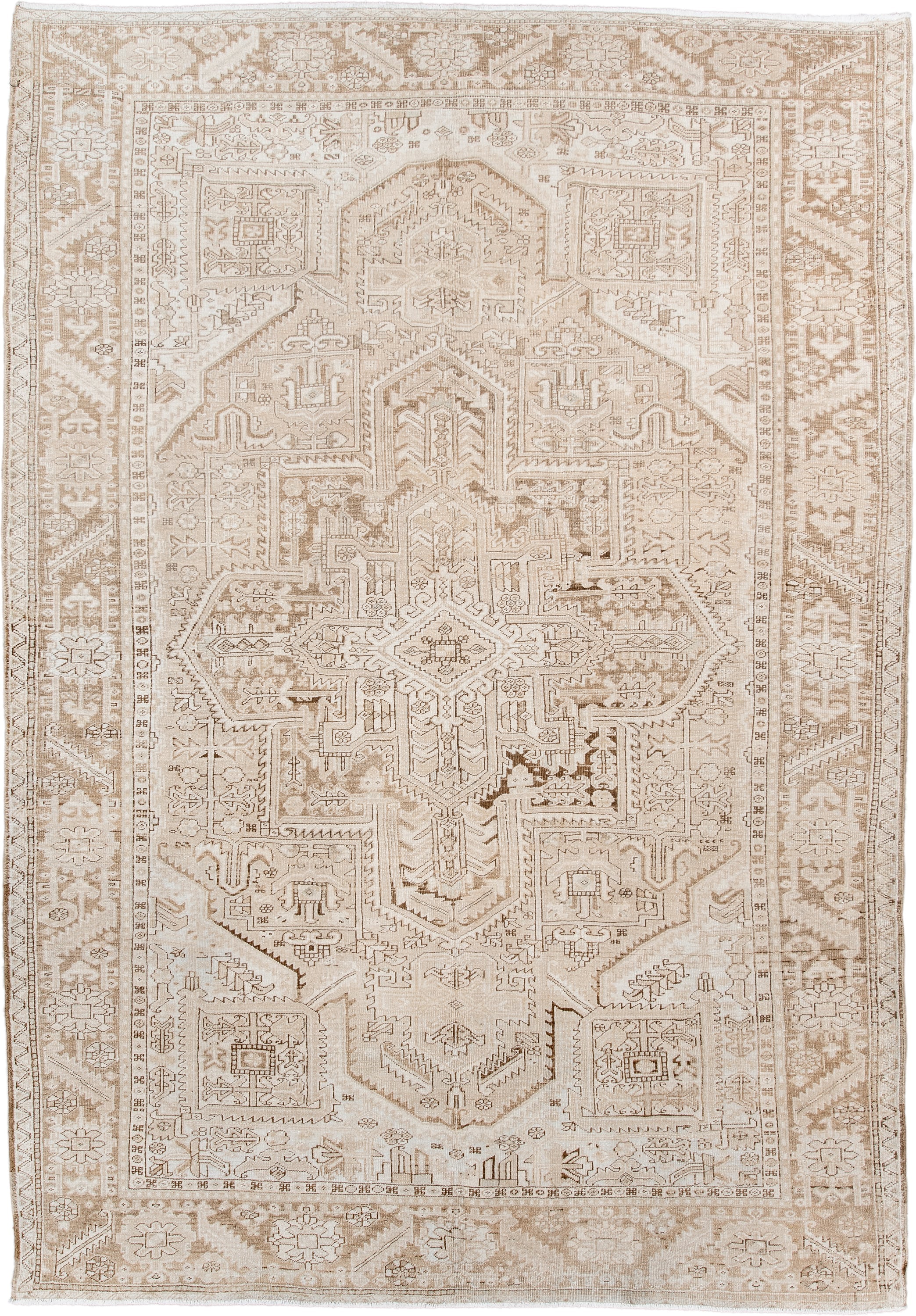 6' x 9' one-of-a-kind handmade antique Heriz medium size rug. Color palette: ivory, taupe, beige, sand, camel, gray