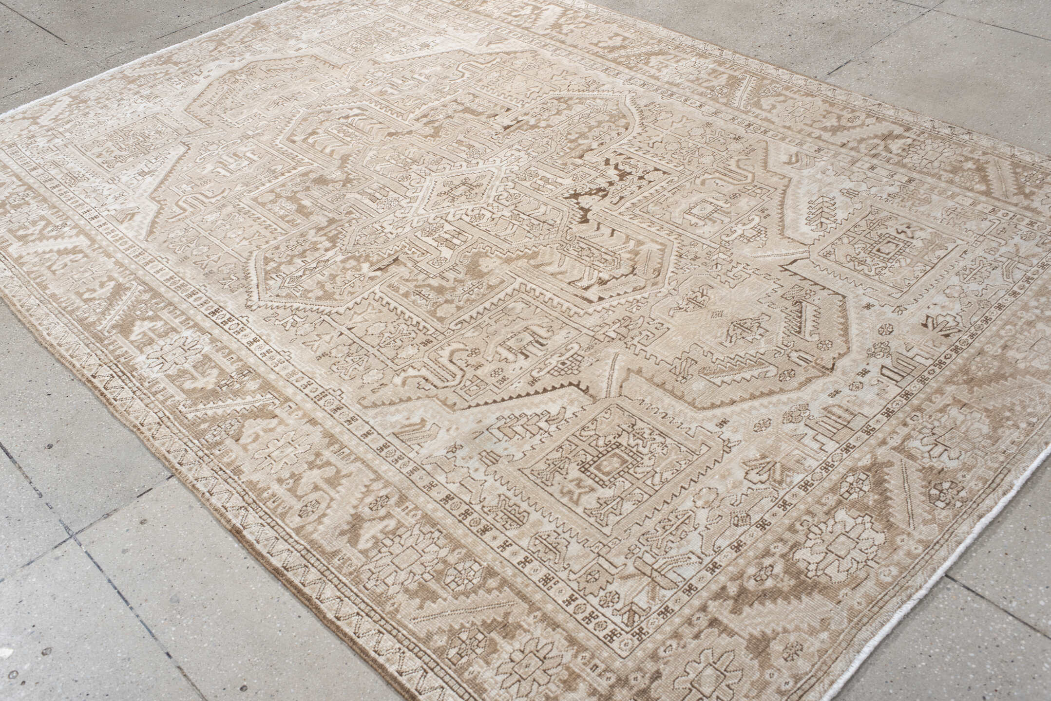 6' x 9' one-of-a-kind handmade antique Heriz medium size rug. Color palette: ivory, taupe, beige, sand, camel, gray