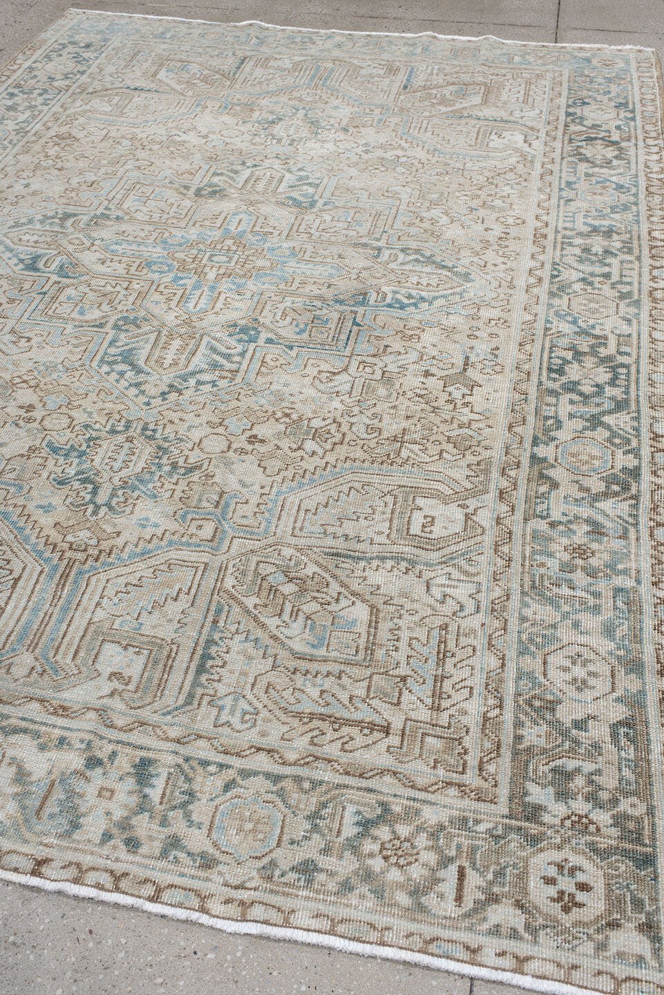 6' x 9' one-of-a-kind handmade antique Heriz medium size rug. Color palette: ivory, sky blue, taupe, beige, slate, camel