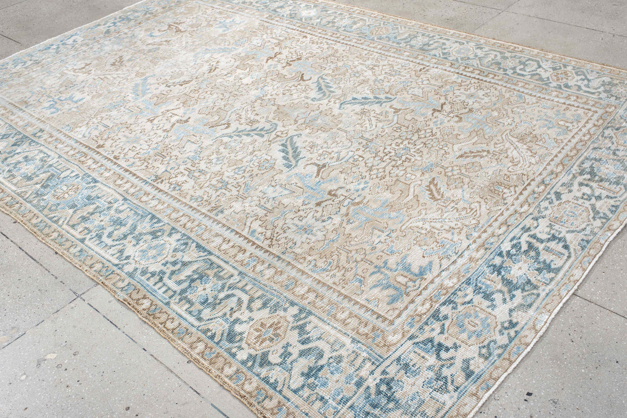 7' x 10' one-of-a-kind handmade antique Heriz large size rug. Color palette: ivory, light blue, taupe, beige, cream, gray