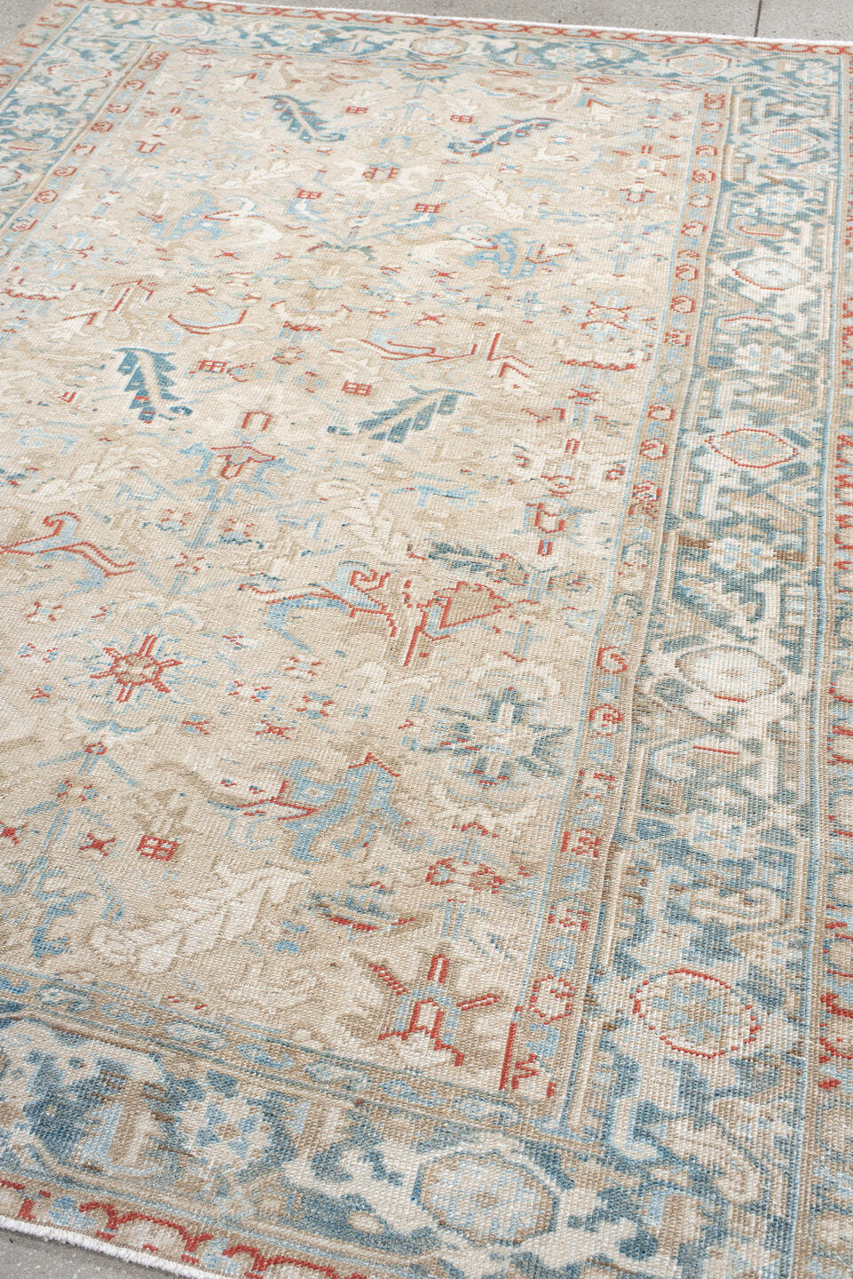 6' x 8' one-of-a-kind handmade antique Heriz medium size rug. Color palette: ivory, pale blue, rust, beige, sky blue