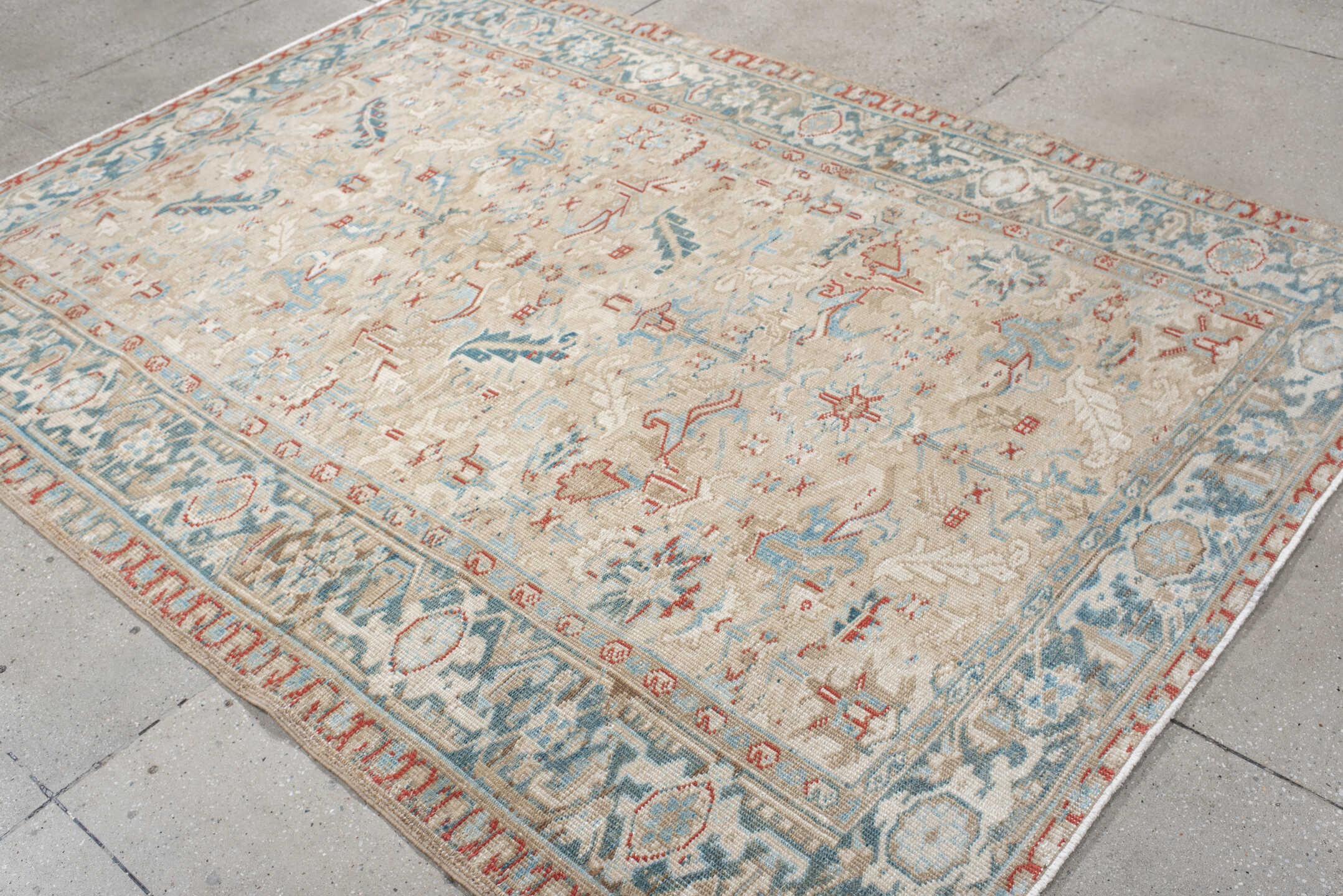 6' x 8' one-of-a-kind handmade antique Heriz medium size rug. Color palette: ivory, pale blue, rust, beige, sky blue