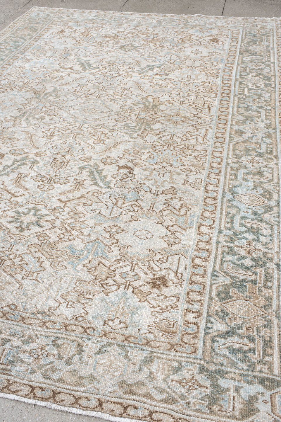 7' x 11' one-of-a-kind handmade antique Heriz large size rug. Color palette: ivory, pale aqua, camel, taupe, sage, cream