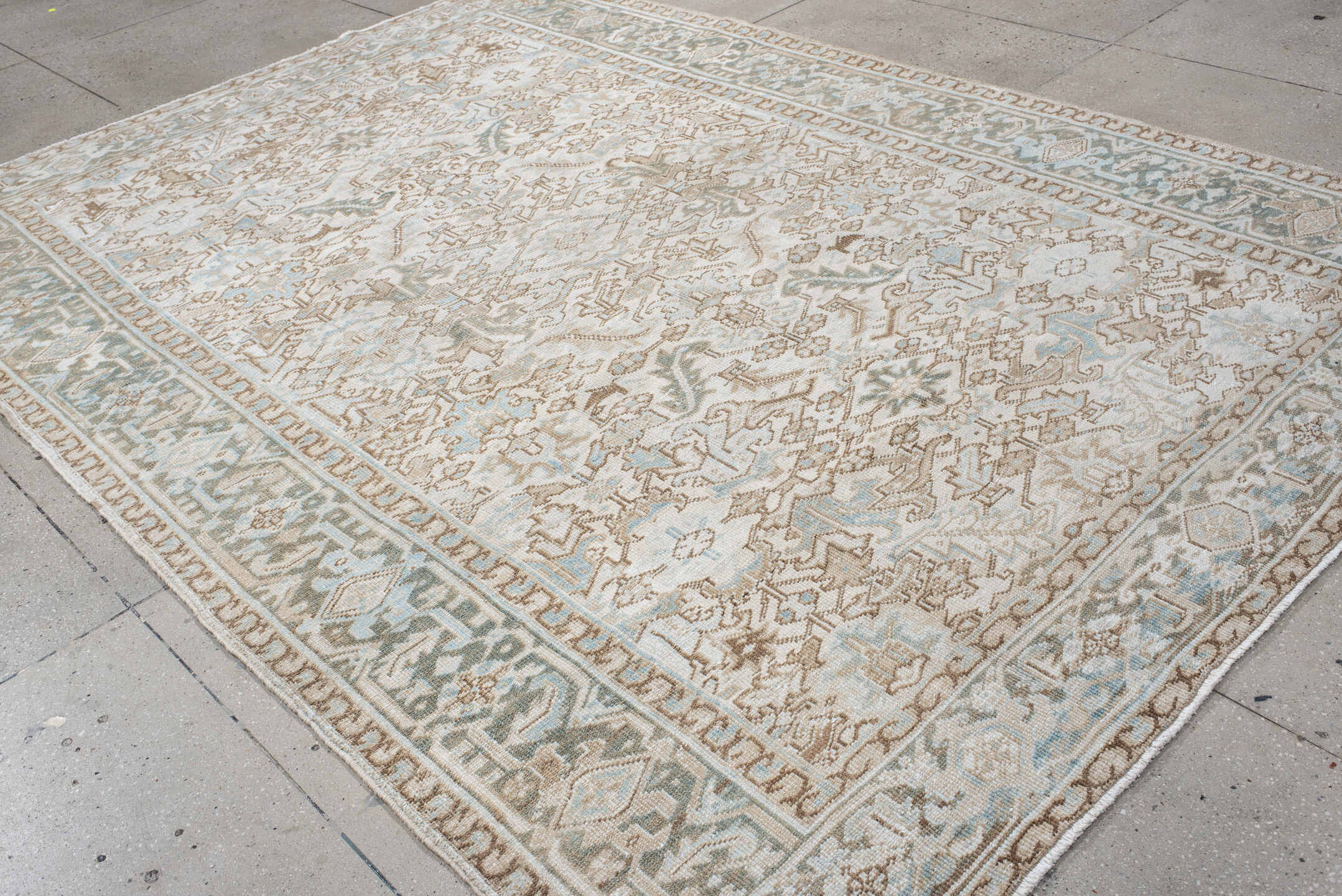 7' x 11' one-of-a-kind handmade antique Heriz large size rug. Color palette: ivory, pale aqua, camel, taupe, sage, cream