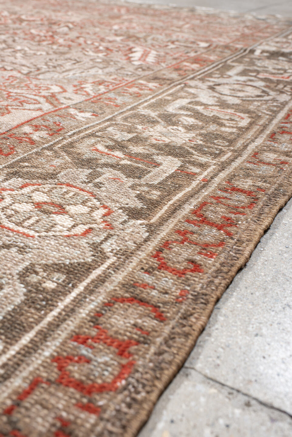 7' x 10' one-of-a-kind handmade antique Heriz large size rug. Color palette: taupe, ivory, charcoal, coral, brown, gray