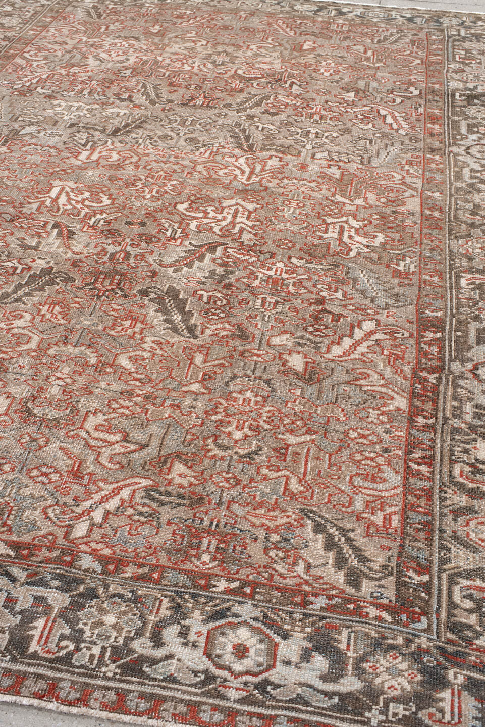7' x 10' one-of-a-kind handmade antique Heriz large size rug. Color palette: taupe, ivory, charcoal, coral, brown, gray