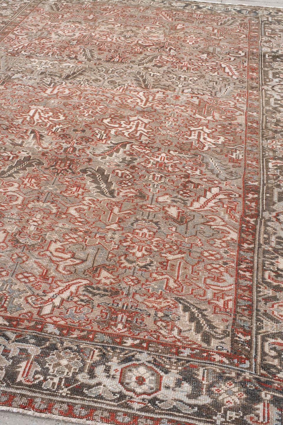 7' x 10' one-of-a-kind handmade antique Heriz large size rug. Color palette: taupe, ivory, charcoal, coral, brown, gray