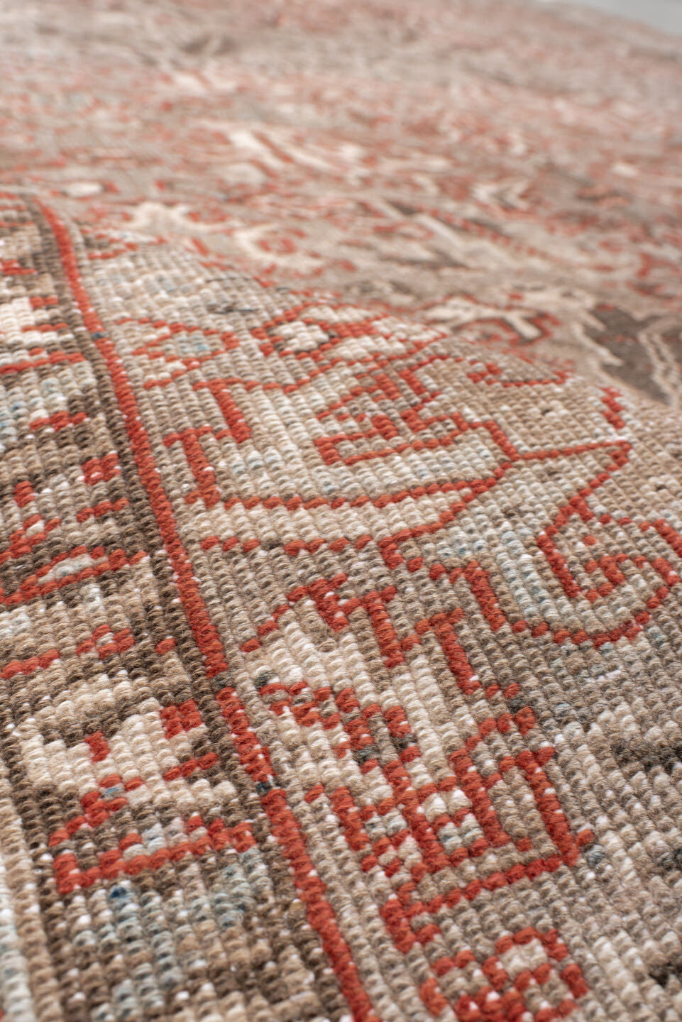 7' x 10' one-of-a-kind handmade antique Heriz large size rug. Color palette: taupe, ivory, charcoal, coral, brown, gray