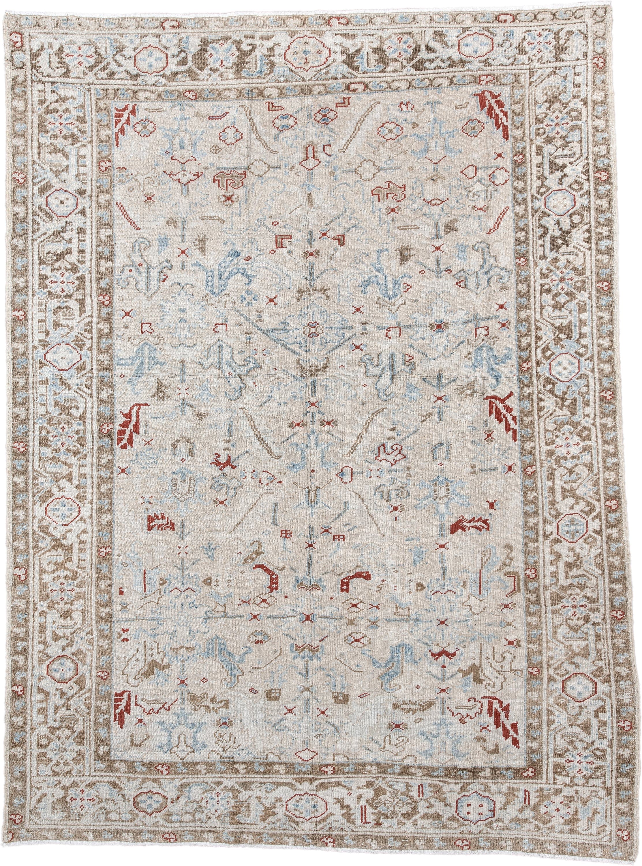 6' x 8' one-of-a-kind handmade antique Heriz medium size rug. Color palette: ivory, taupe, light blue, rust, beige, gray