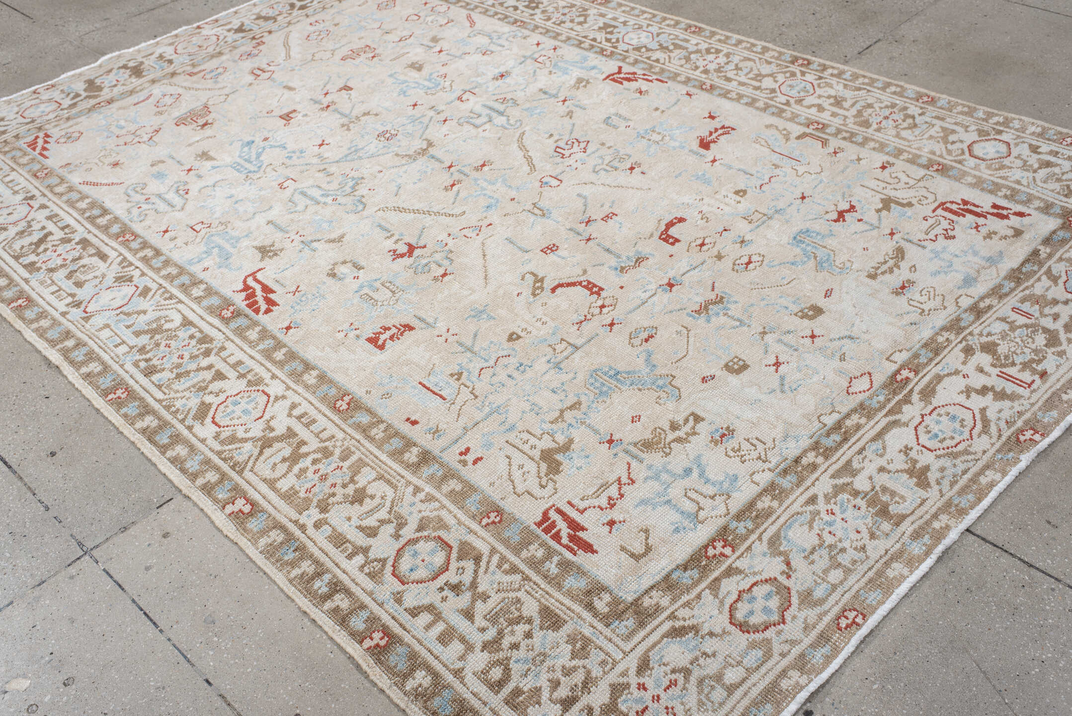 6' x 8' one-of-a-kind handmade antique Heriz medium size rug. Color palette: ivory, taupe, light blue, rust, beige, gray