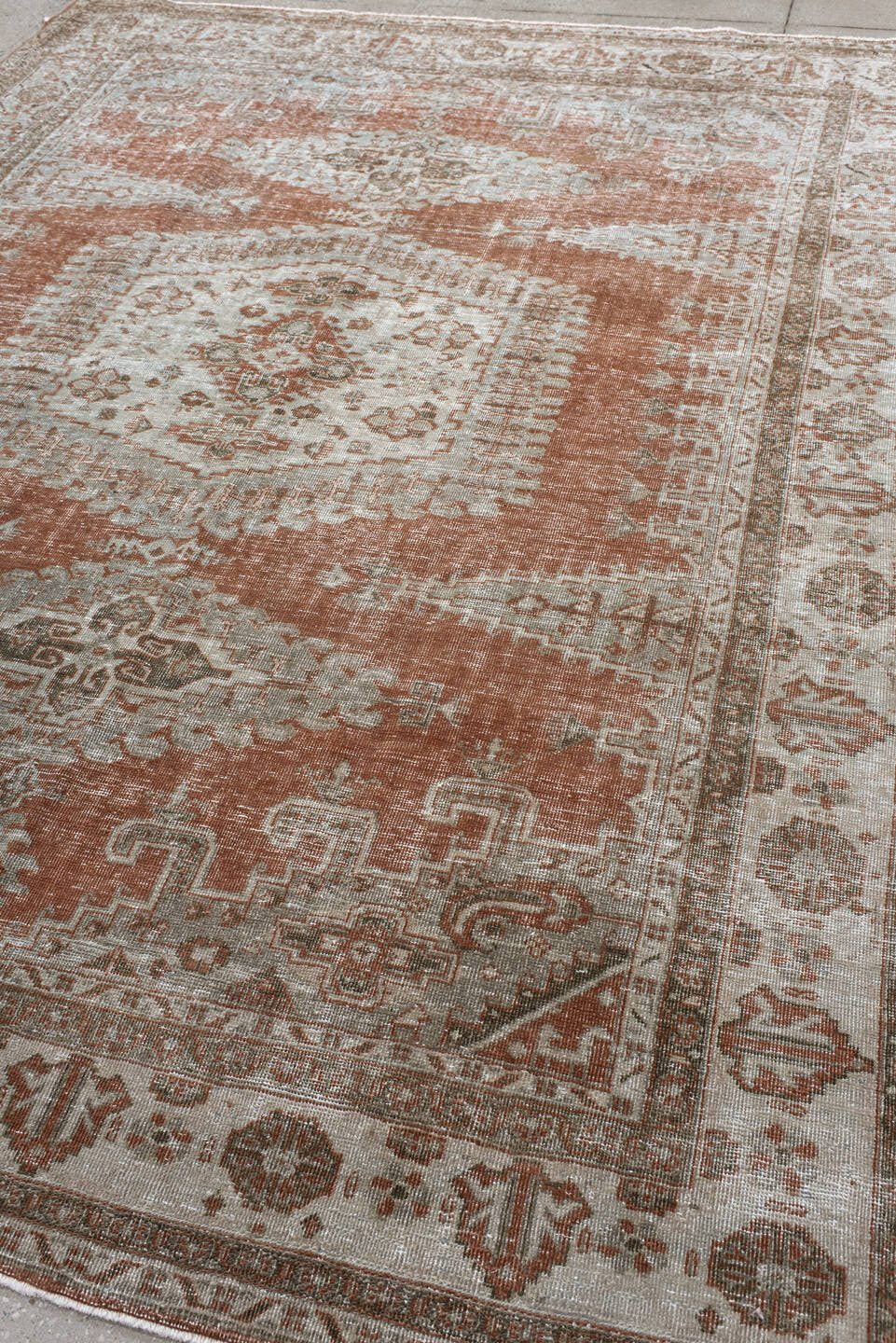 7' x 9' one-of-a-kind handmade antique Veece large size rug. Color palette: terra cotta, ivory, taupe, camel, sage, charcoal