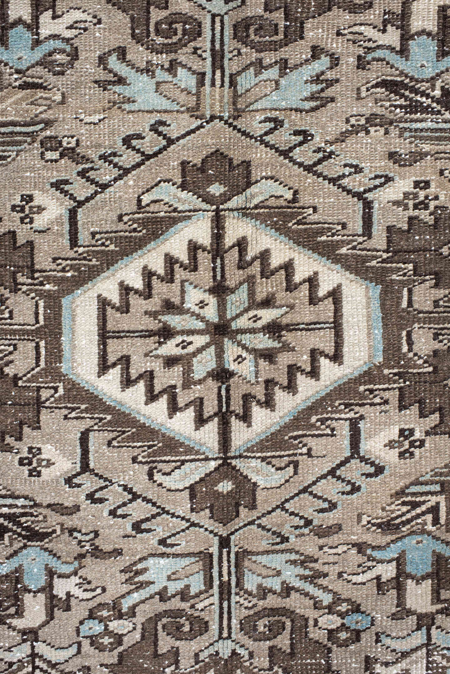 8' x 9' one-of-a-kind handmade antique Heriz rug. Color palette: taupe, ivory, brown, camel, pale blue, charcoal, beige