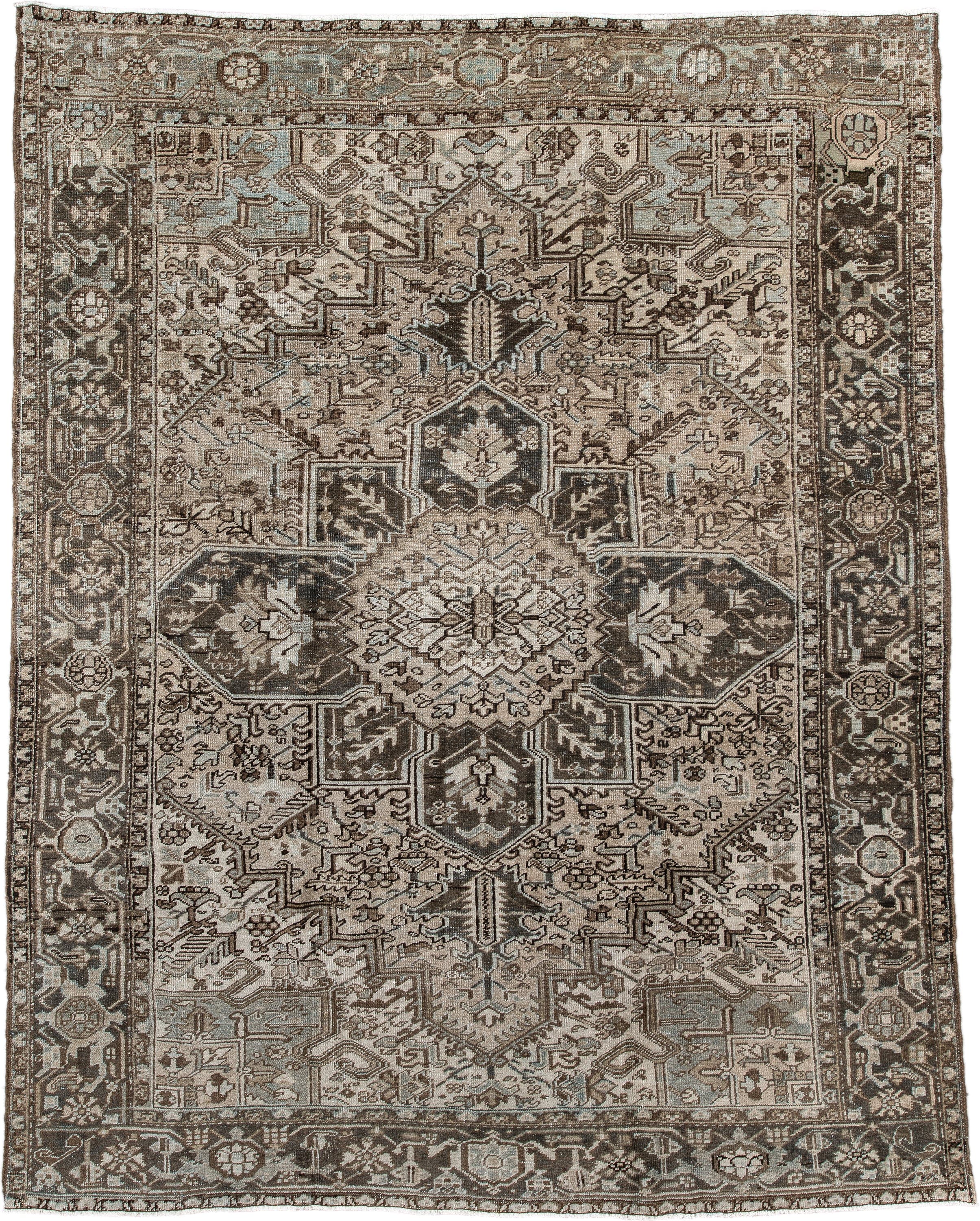7' x 9' one-of-a-kind handmade antique Heriz large size rug. Color palette: taupe, charcoal, ivory, camel, slate, brown