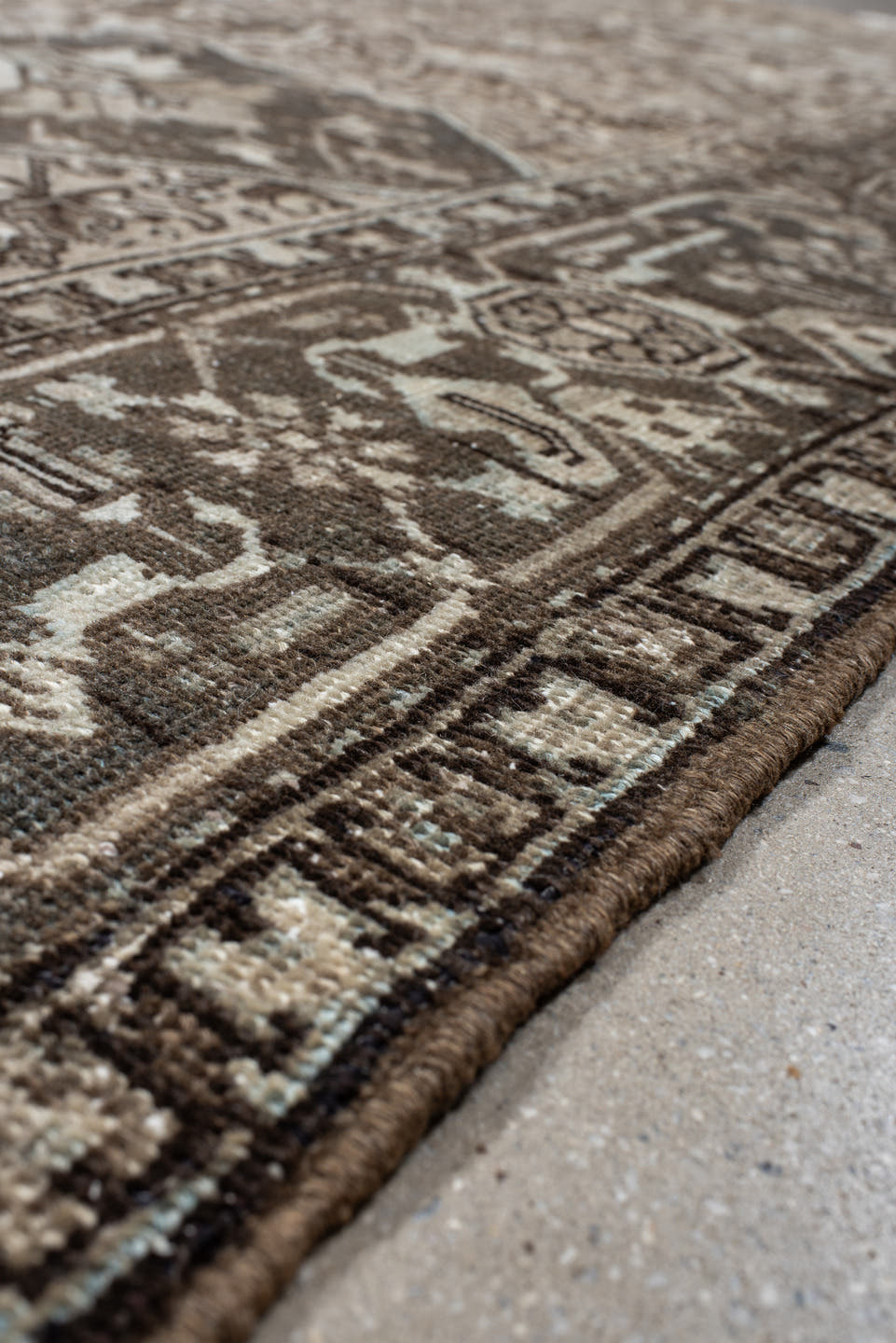 7' x 9' one-of-a-kind handmade antique Heriz large size rug. Color palette: taupe, charcoal, ivory, camel, slate, brown