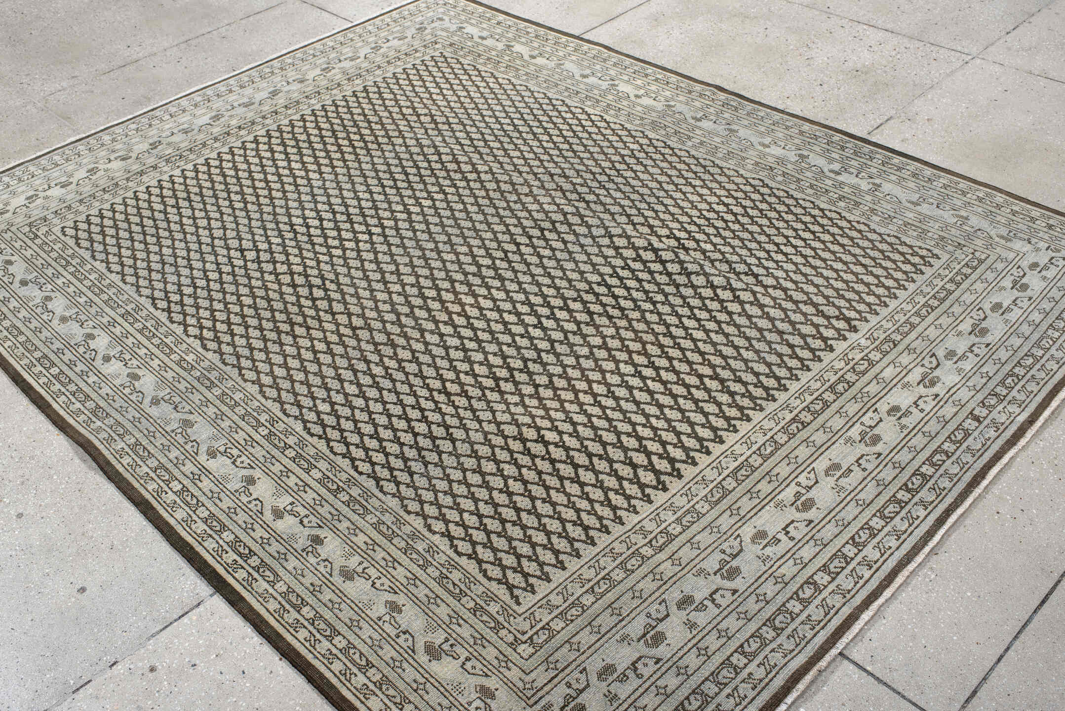6' x 7' one-of-a-kind handmade antique Mir rug. Color palette: ivory, brown, taupe, camel, charcoal, beige, gray, black
