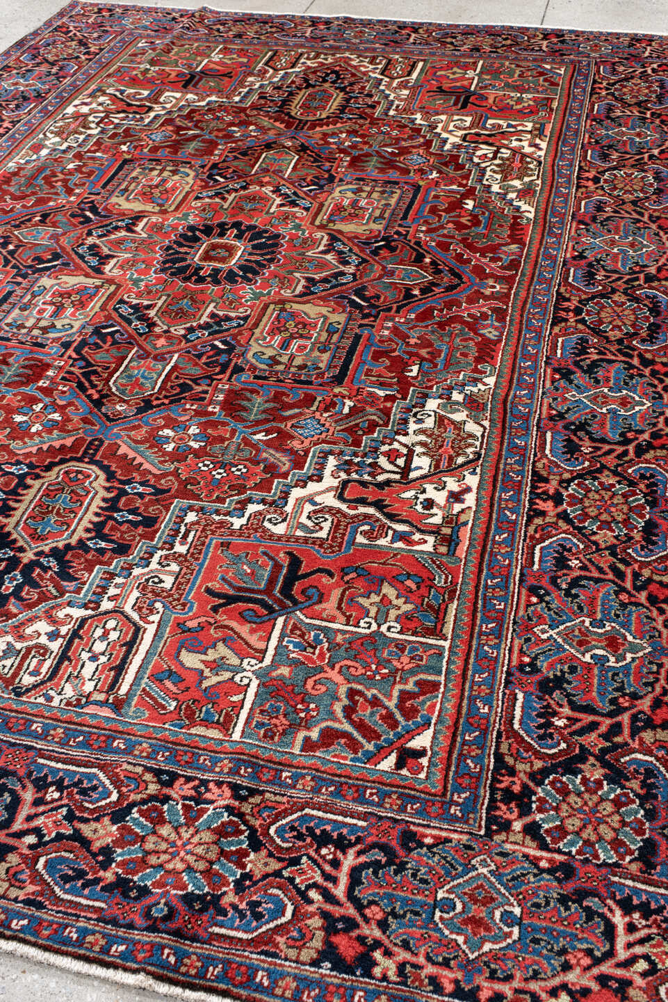 8' x 11' one-of-a-kind handmade antique Heriz large size rug. Color palette: rust, navy, ivory, sky_blue, brick, coral