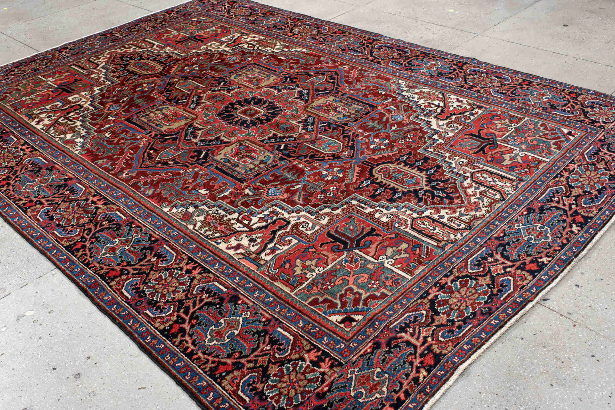 8' x 11' one-of-a-kind handmade antique Heriz large size rug. Color palette: rust, navy, ivory, sky_blue, brick, coral