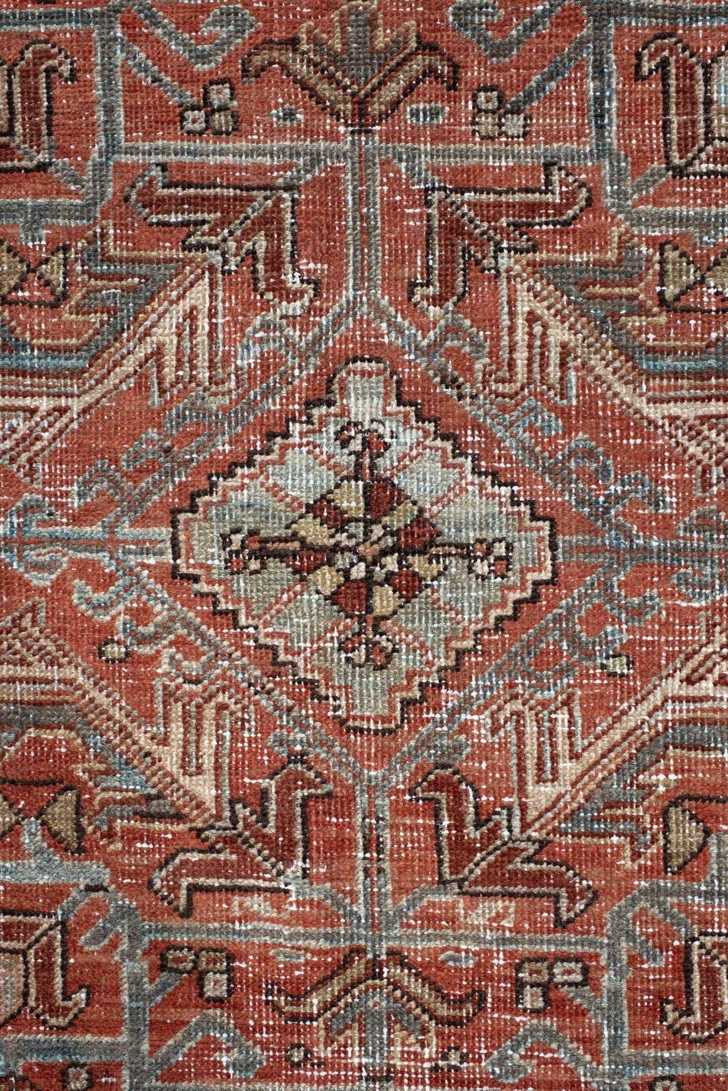 7' x 9' one-of-a-kind handmade antique Heriz large size rug. Color palette: terra cotta, ivory, slate, charcoal, rust, camel