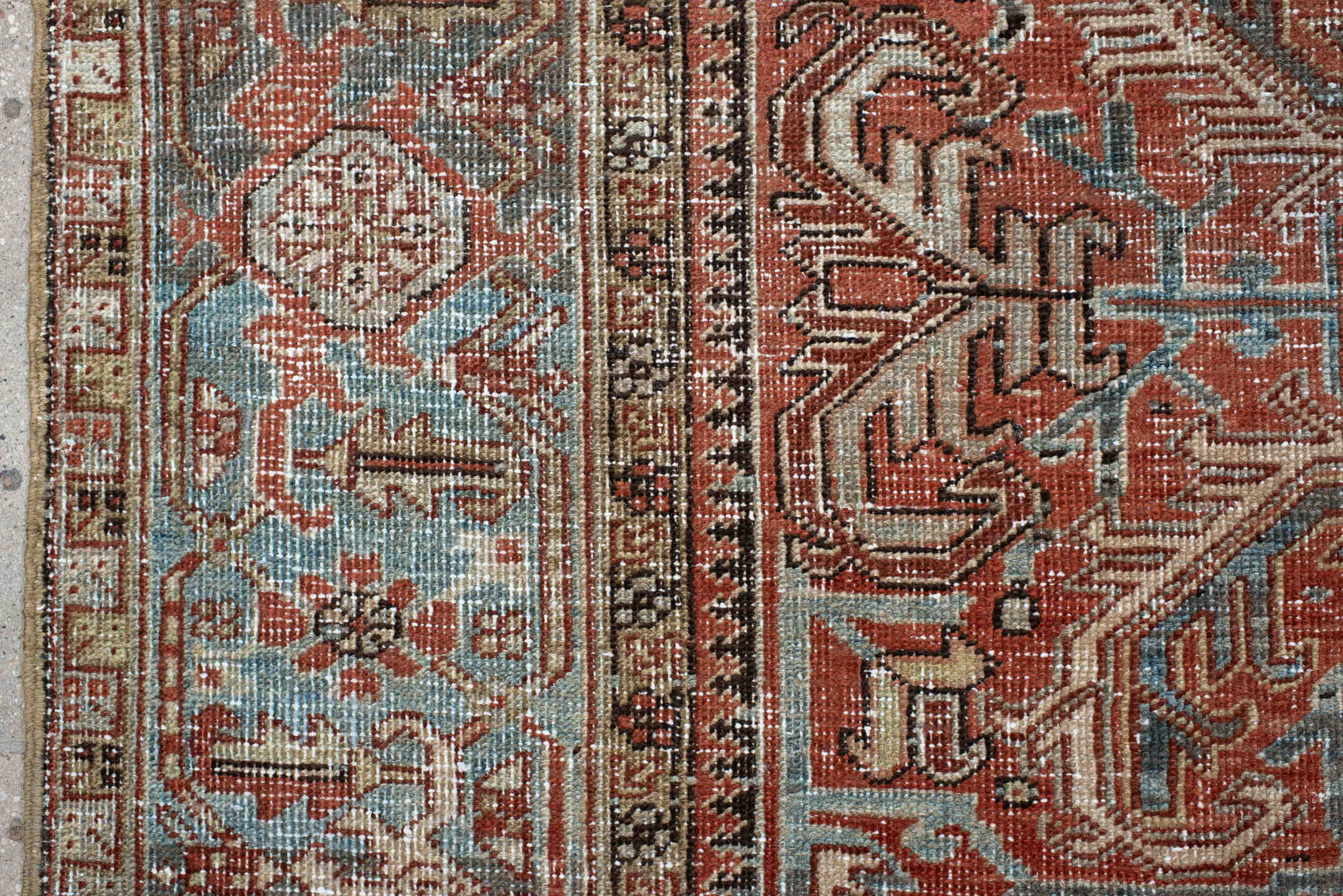 7' x 9' one-of-a-kind handmade antique Heriz large size rug. Color palette: terra cotta, ivory, slate, charcoal, rust, camel
