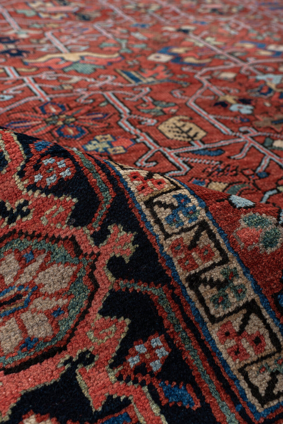 6' x 10' one-of-a-kind handmade antique Heriz large size rug. Color palette: rust, navy, ivory, sky_blue, sage, coral, camel